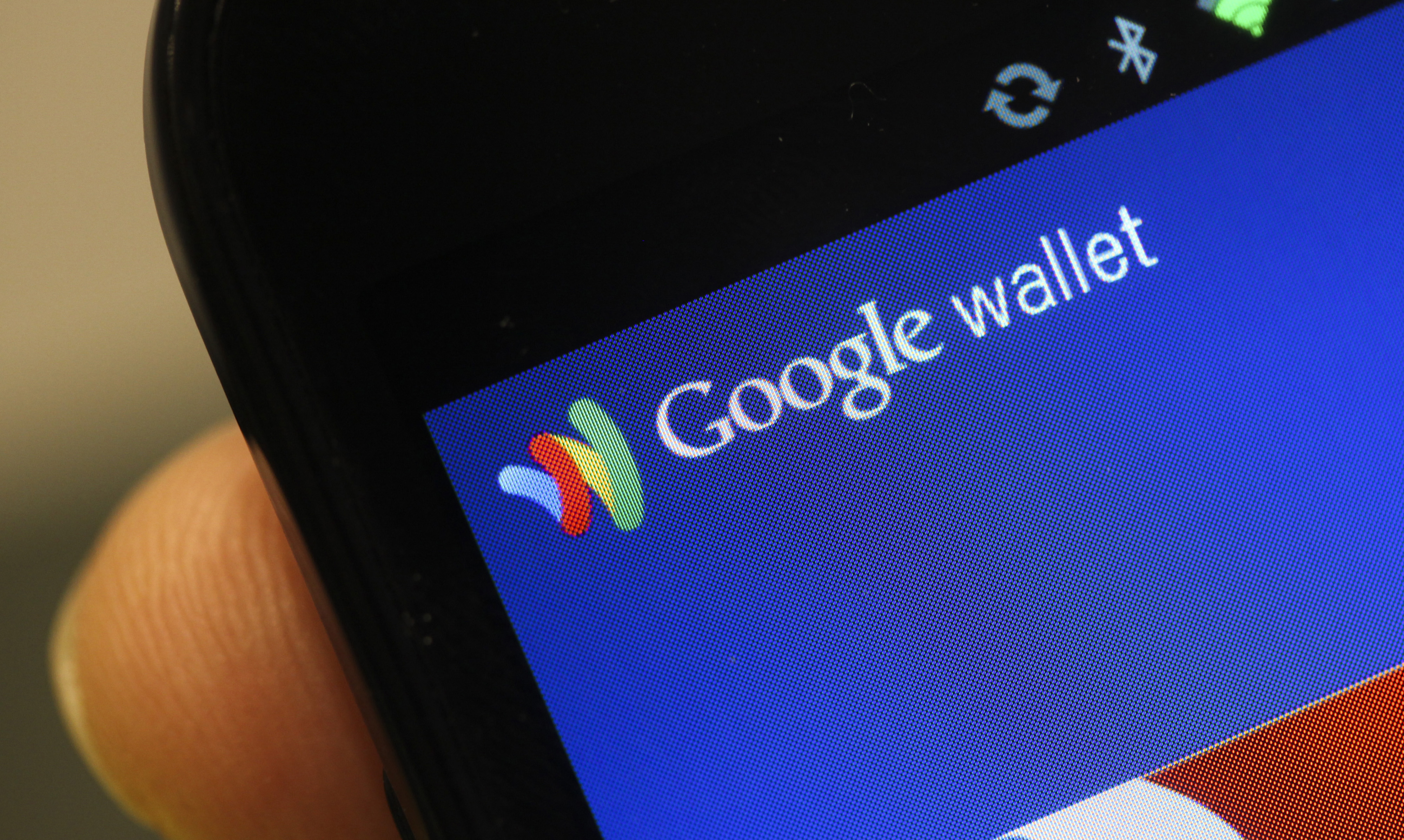 The Google Inc. Mobile Wallet application is displayed on a smartphone screen at the Mobile World Congress in Barcelona, Spain, on Feb. 29, 2012.