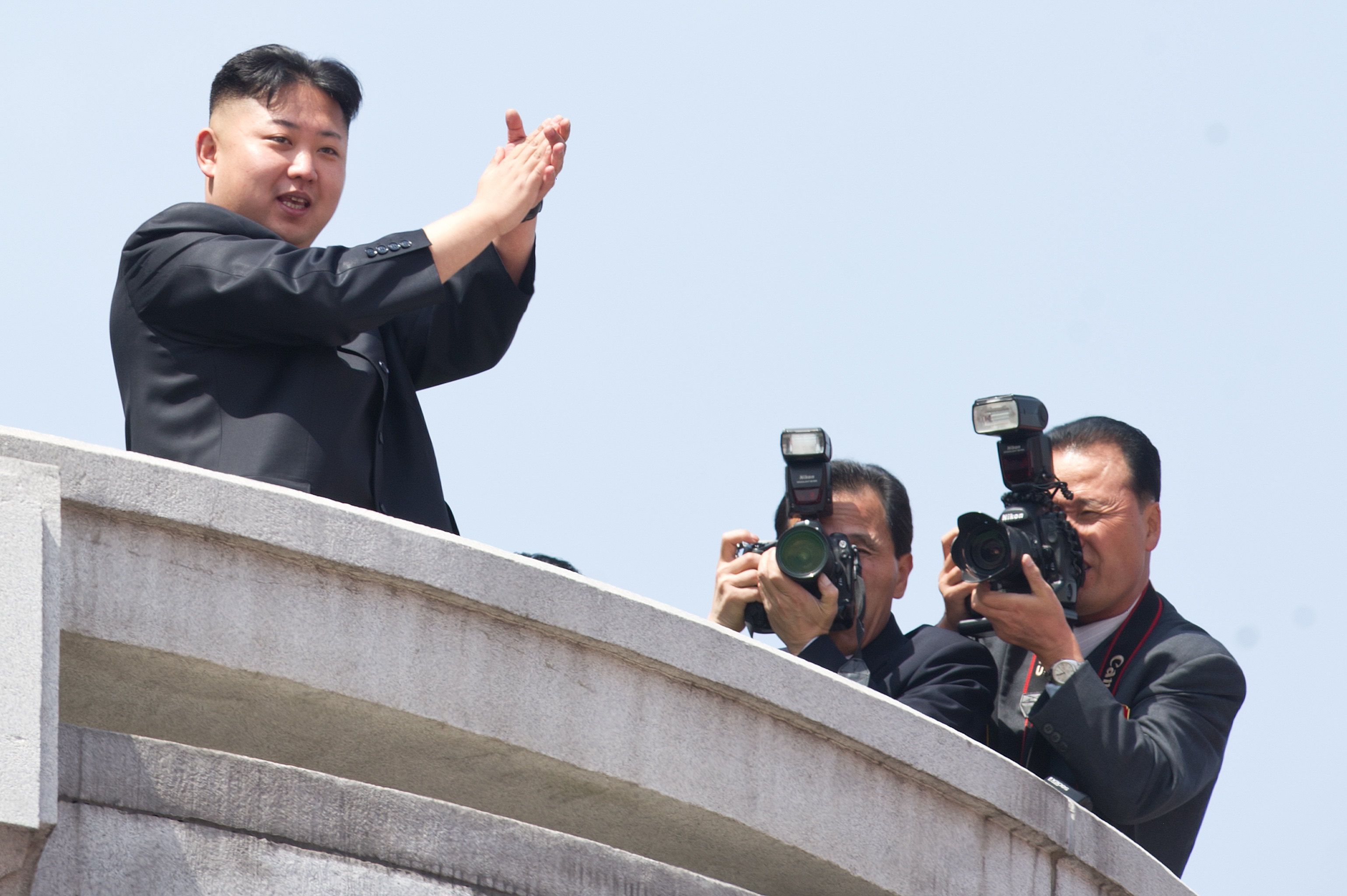 North Korean leader Kim Jong-Un (L) applauds during a military parade in honour of the 100th birthday of the late North Korean leader Kim Il-Sung in Pyongyang on April 15, 2012. (ED JONES—AFP/Getty Images)