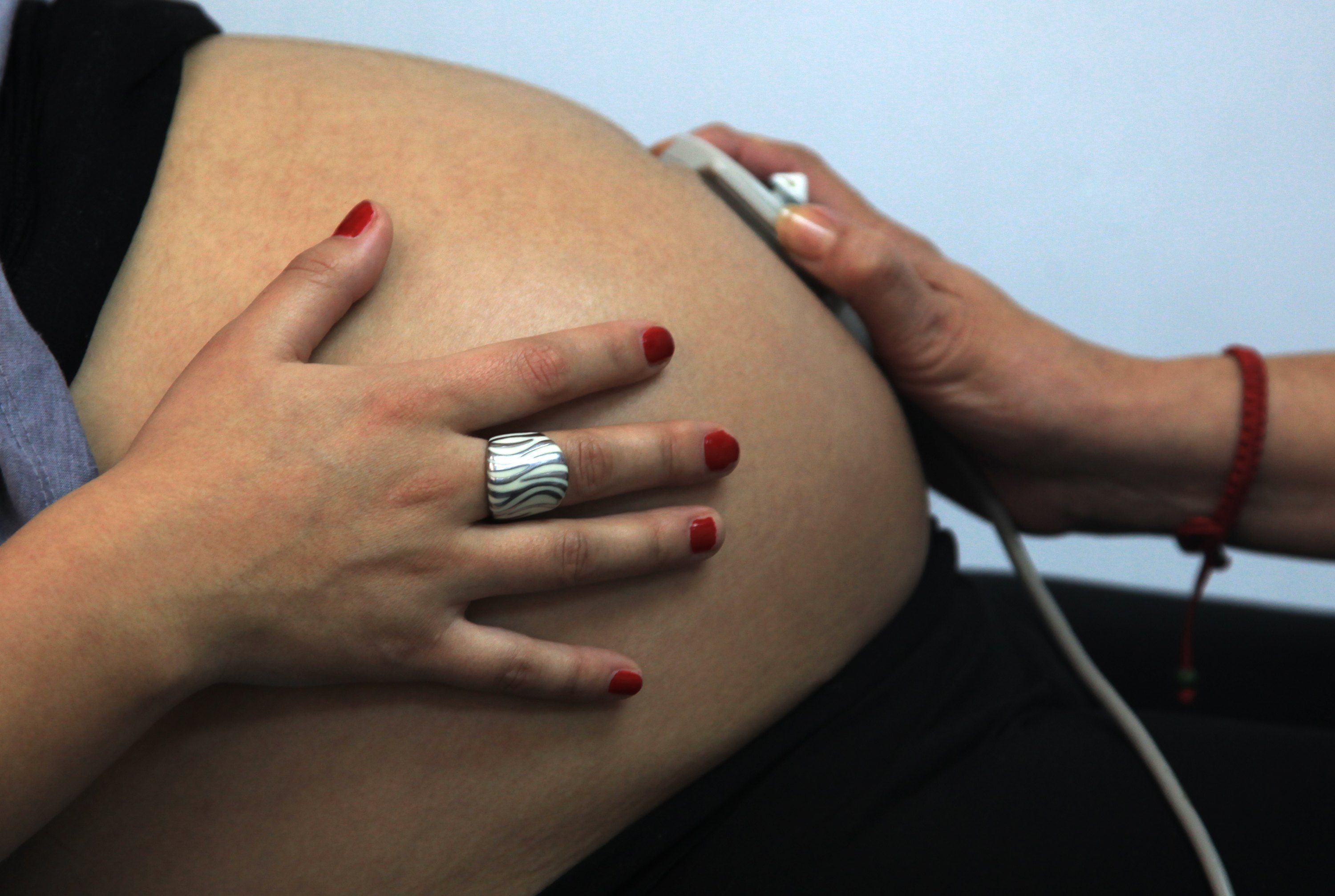 Rayen Luna Solar, 27,  33-week pregnant, is seen by a midwife in a routine checkup, in Santiago, on July 13, 2012. (AFP&mdash;AFP/Getty Images)