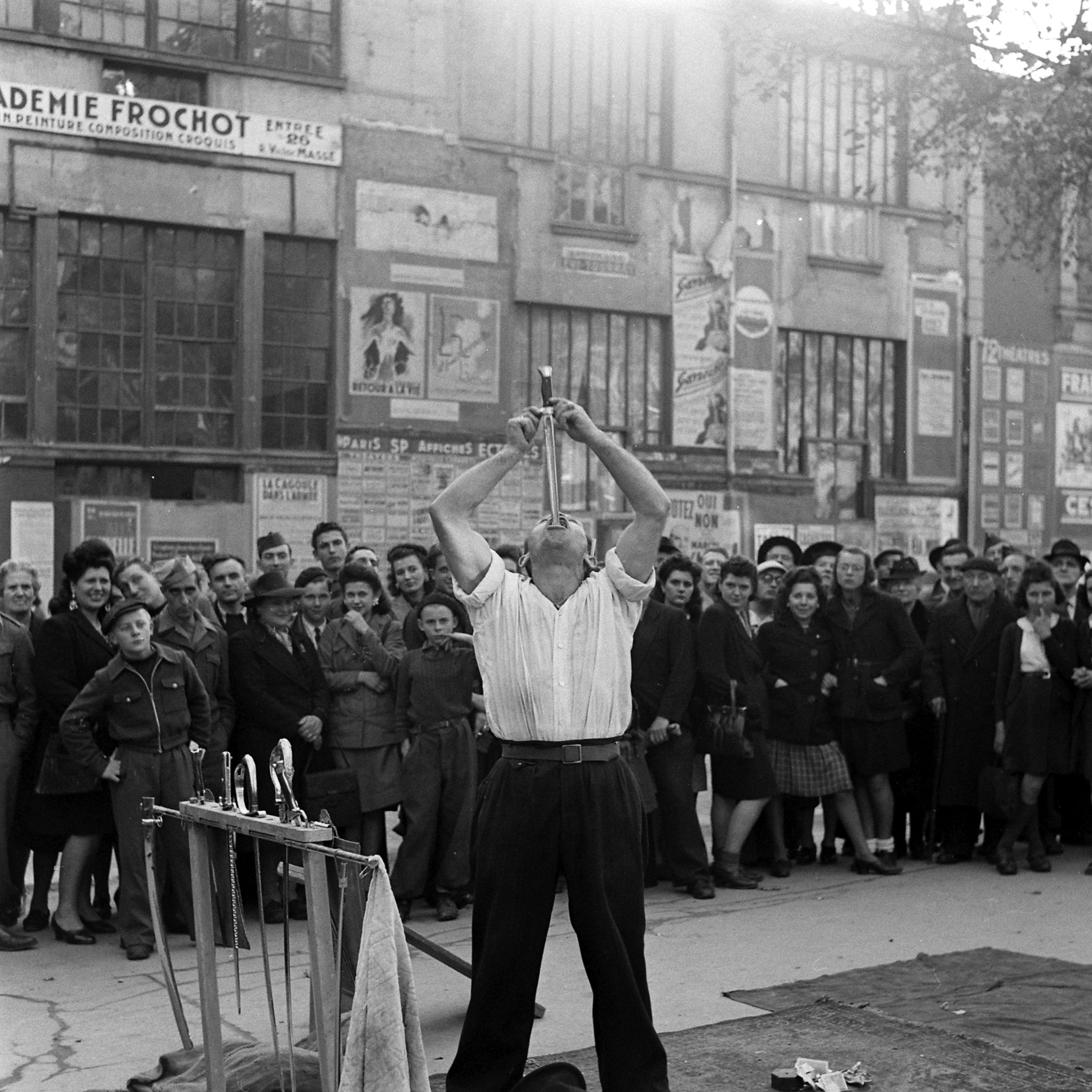 Sword Swallower in the Pigalle section of Paris, 1945.