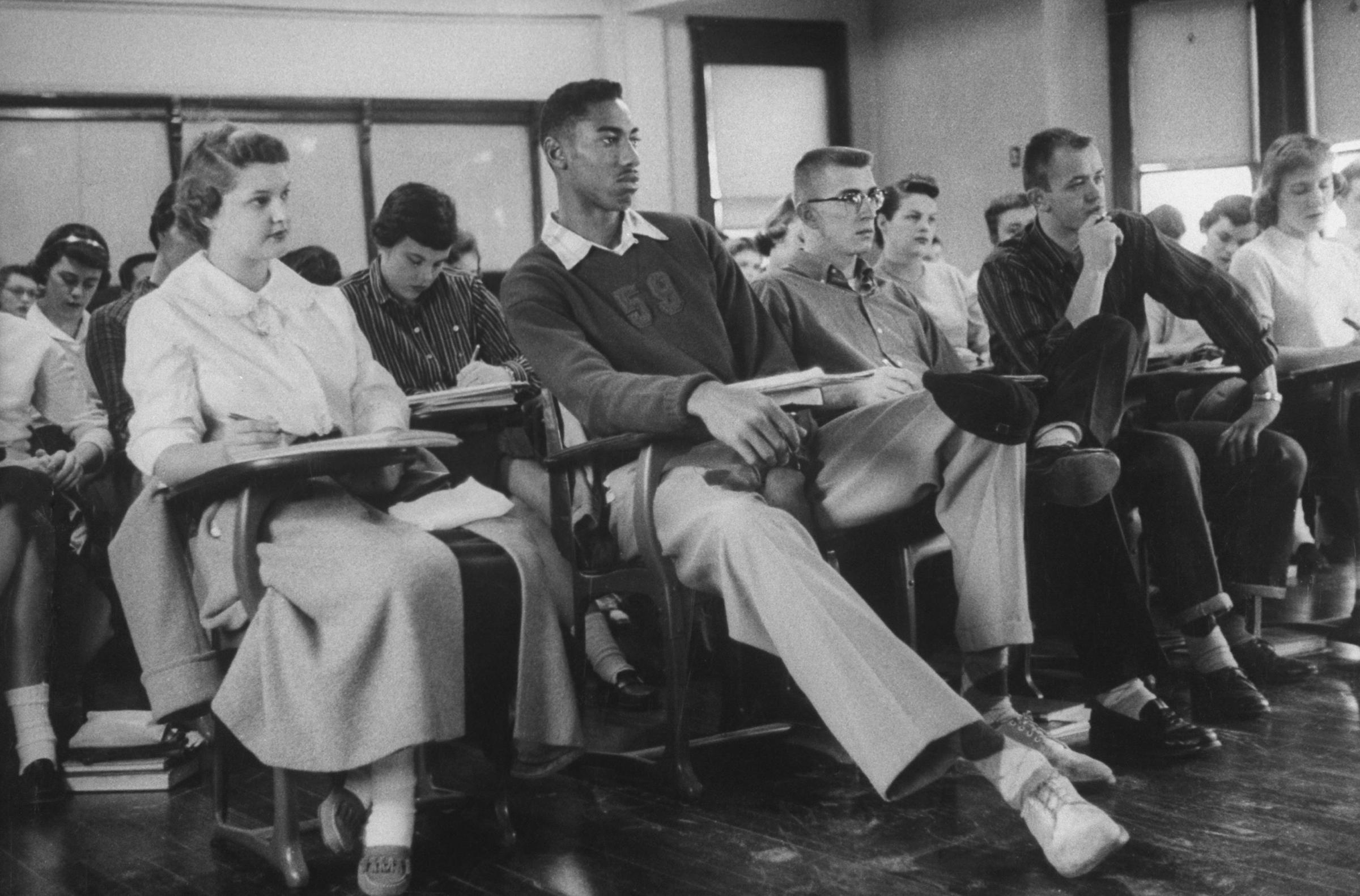 University of Kansas basketball player Wilt Chamberlain in class, 1957.