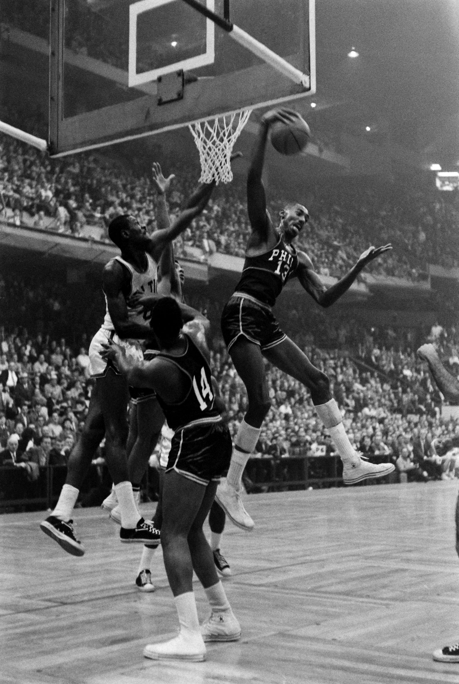 Basketball player Wilt Chamberlain during game against the Celtics, 1959.