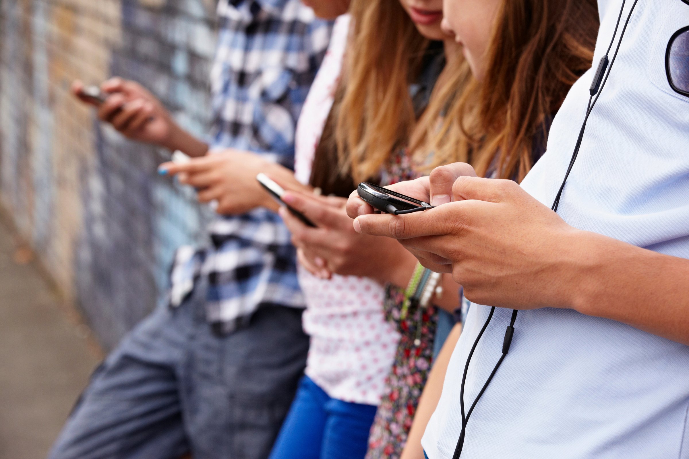 Teenagers using cellphones