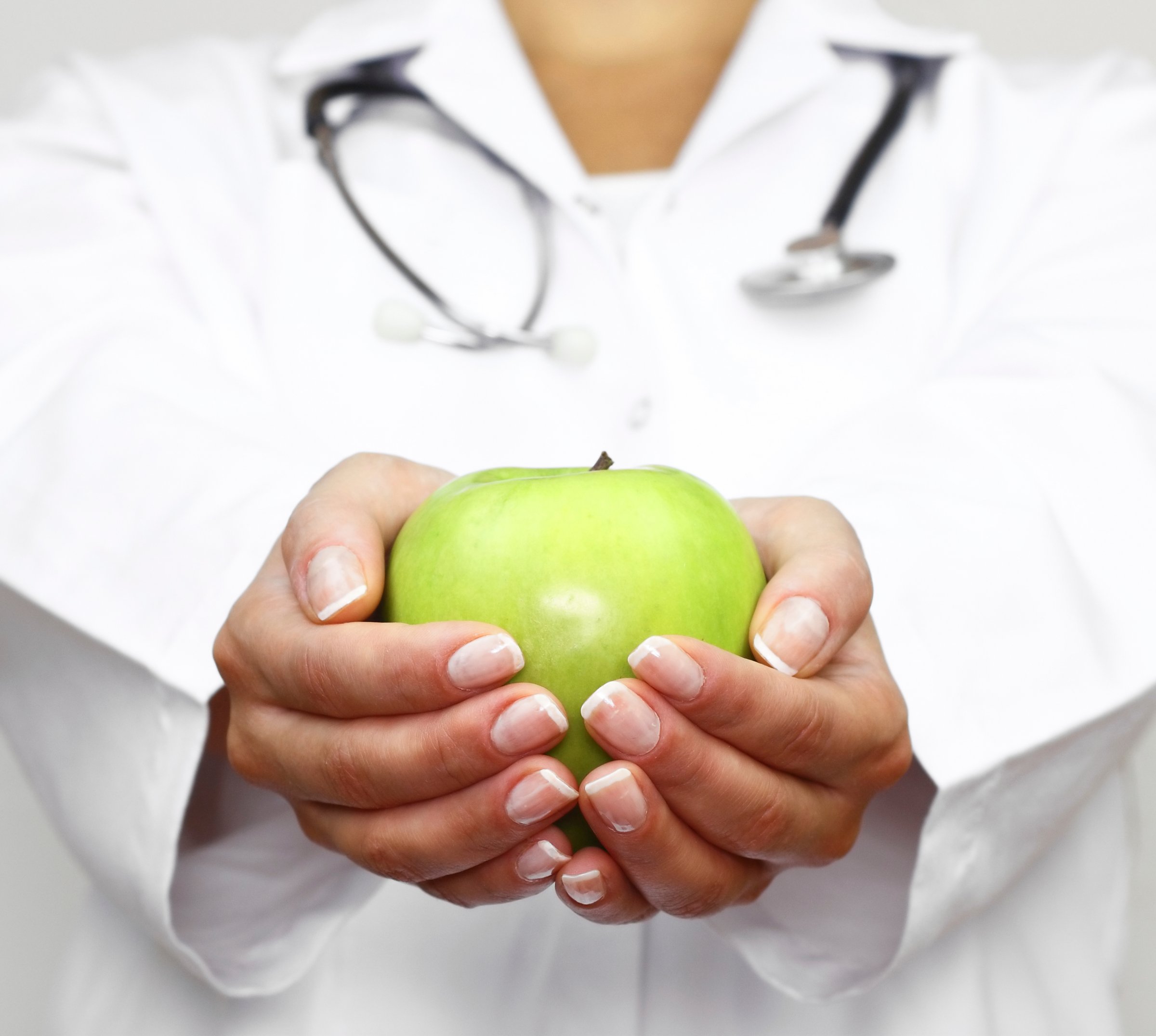 doctor-holding-green-apple