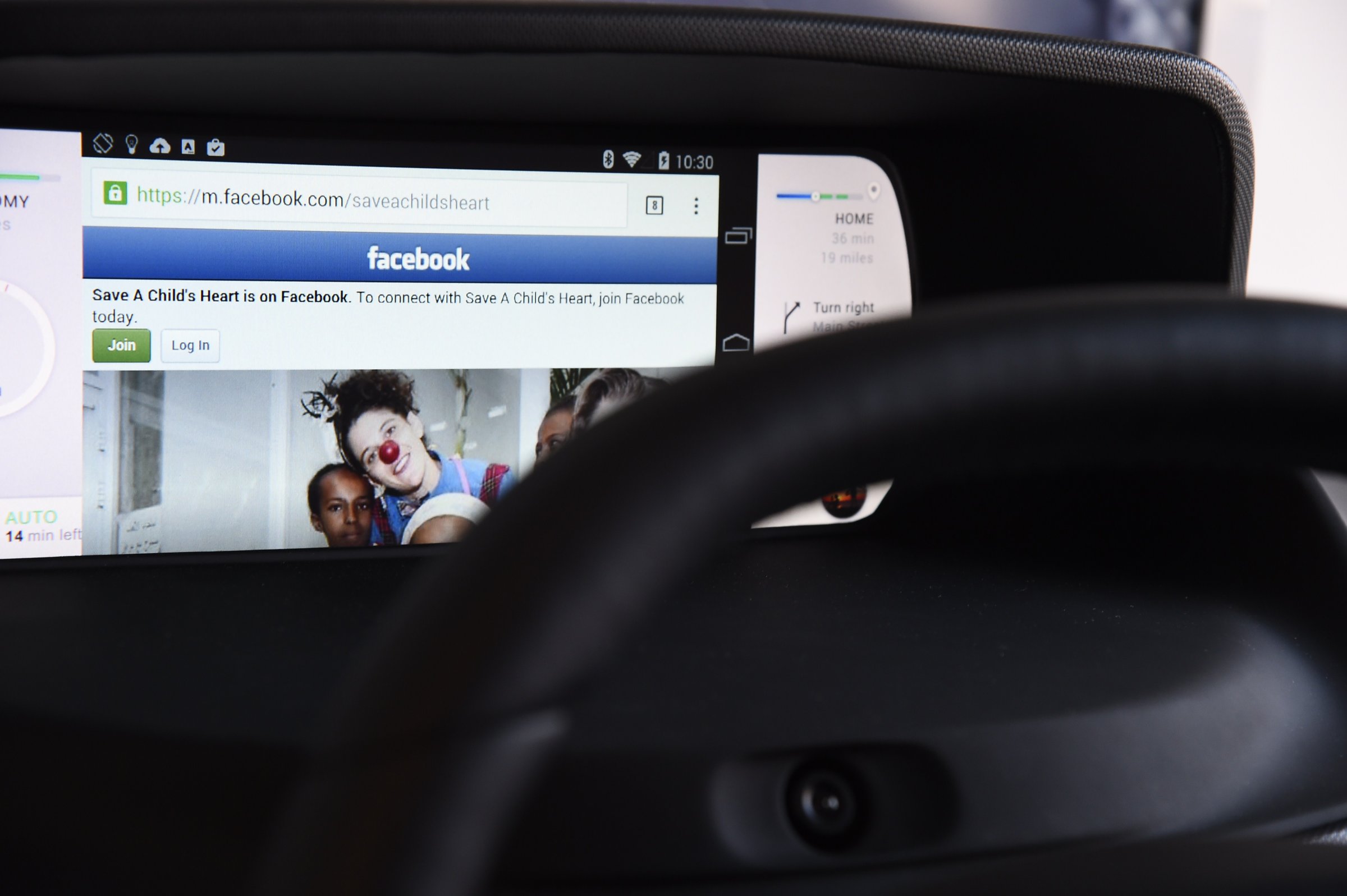 Facebook from a wirelessly connected smartphone is seen on an autonomous dashboard.