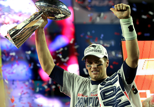 Tom Brady celebrates at a ceremony and celebration after the New England Patriots win Super Bowl XLIX (Barry Chin—The Boston Globe via Getty Images)