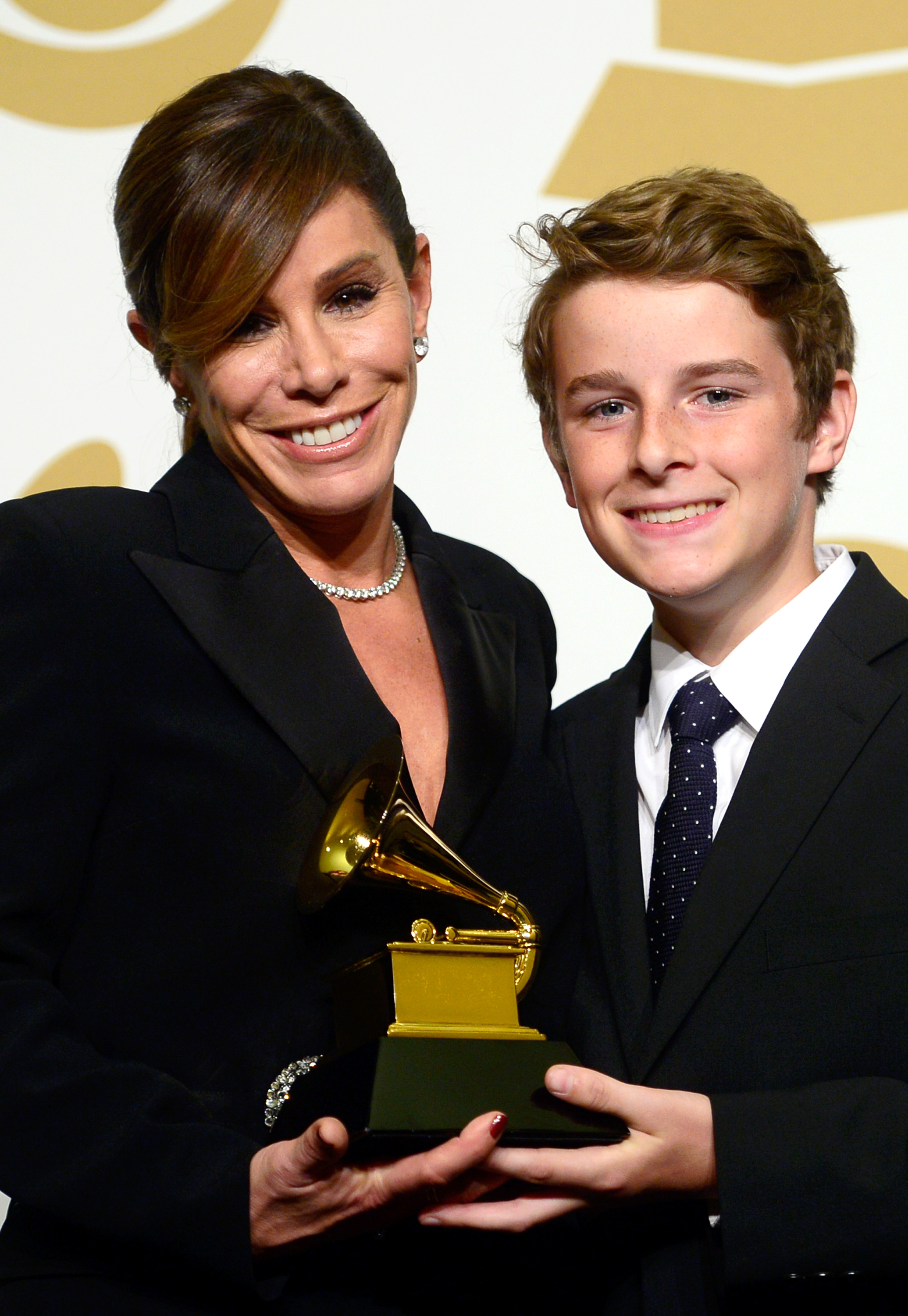 Melissa Rivers (L) and son Cooper Endicott accept Best Spoken Word Album for 'Diary Of A Mad Diva' on behalf of Joan Rivers during The 57th Annual GRAMMY Awards on Feb. 8, 2015 in Los Angeles.