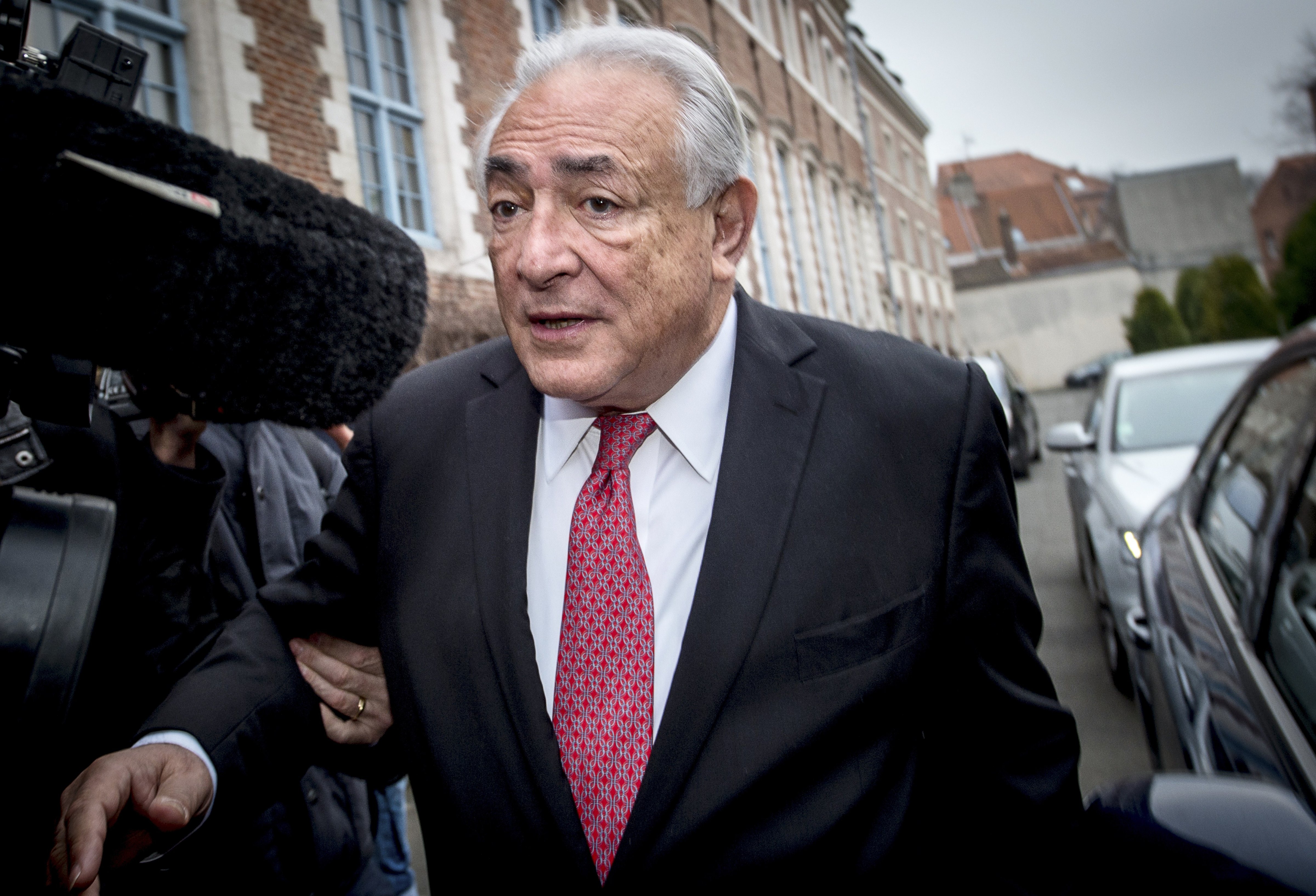 Ex-IMF chief Dominique Strauss-Kahn  leaves his hotel  on his way to the Lille courthouse, northern France, on February 12, 2015. (Philippe Huguen—AFP/Getty Images)