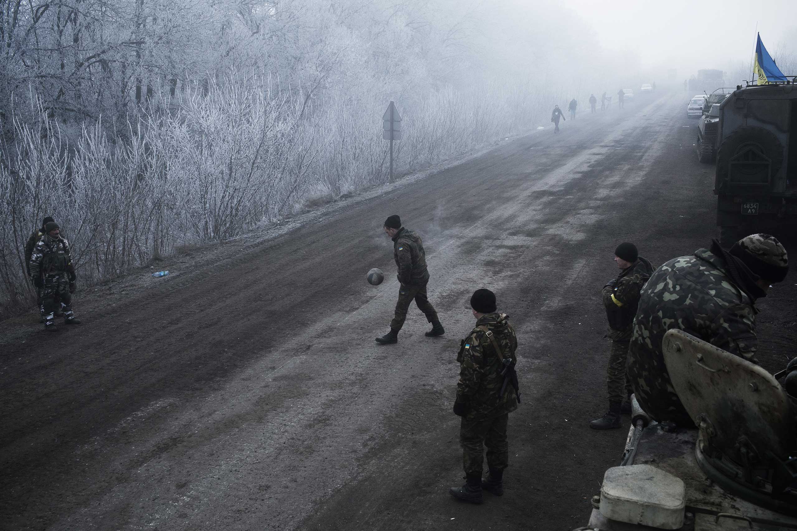 Ukrainian soldiers conduct operations along the road in Artemivsk, Ukraine, leading to the embattled town of Debaltseve Feb. 15, 2015. A ceasefire between Pro-Russian separatists and the Ukrainian forces brokered by the European Union, Russia and Ukraine began at midnight that day.