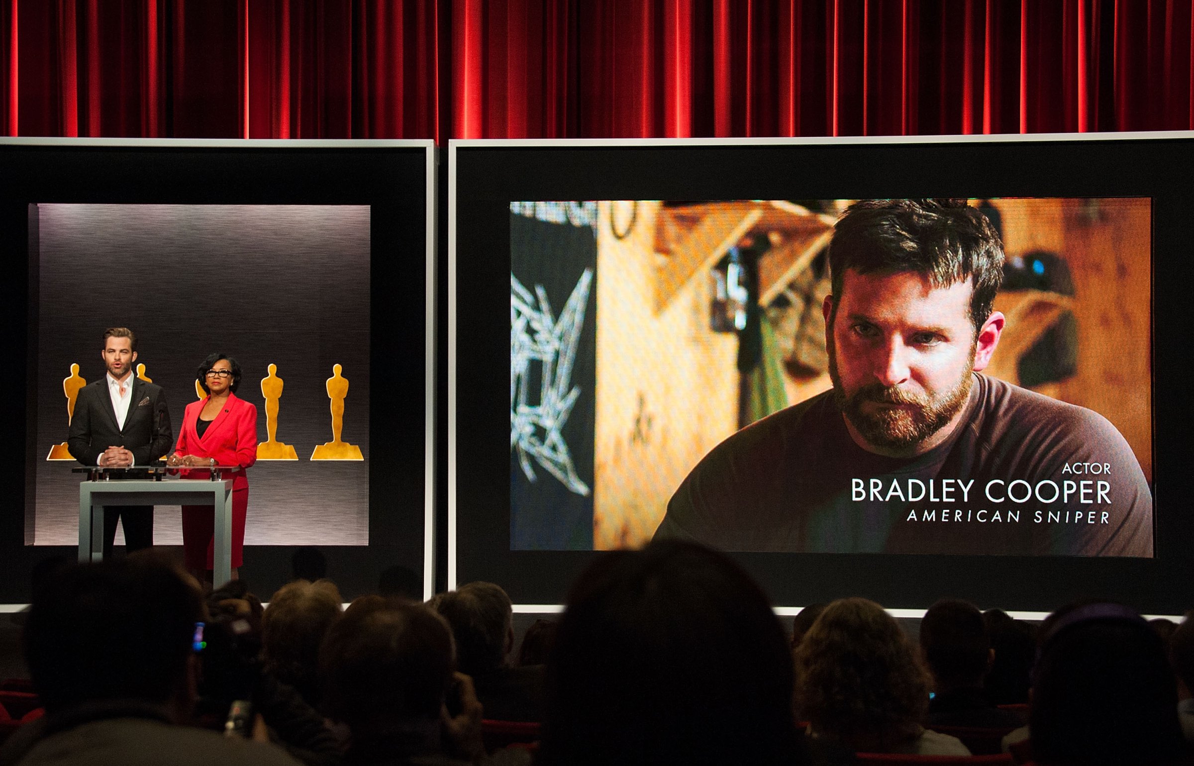 From left: Actor Chris Pine and Academy President Cheryl Boone Isaacs announce Bradley Cooper as a nominee for Best Actor in the film American Sniper at the 87th Academy Awards Nominations Announcement on Jan. 15, 2015 in Beverly Hills, California.