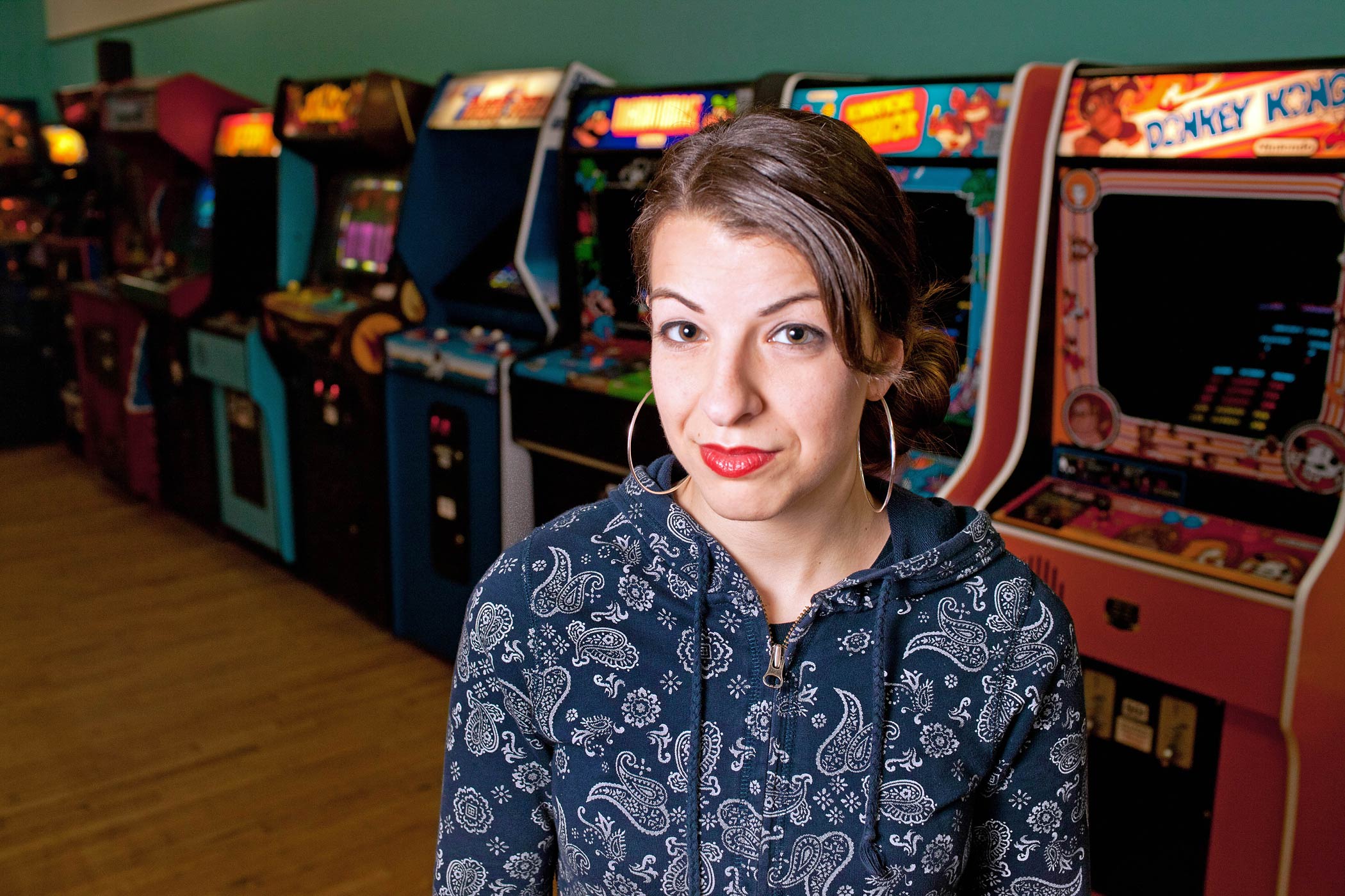 Anita Sarkeesian is seen with vintage video game machines in Minneapolis, Minn in 2013. (Alex Lazara—AP)
