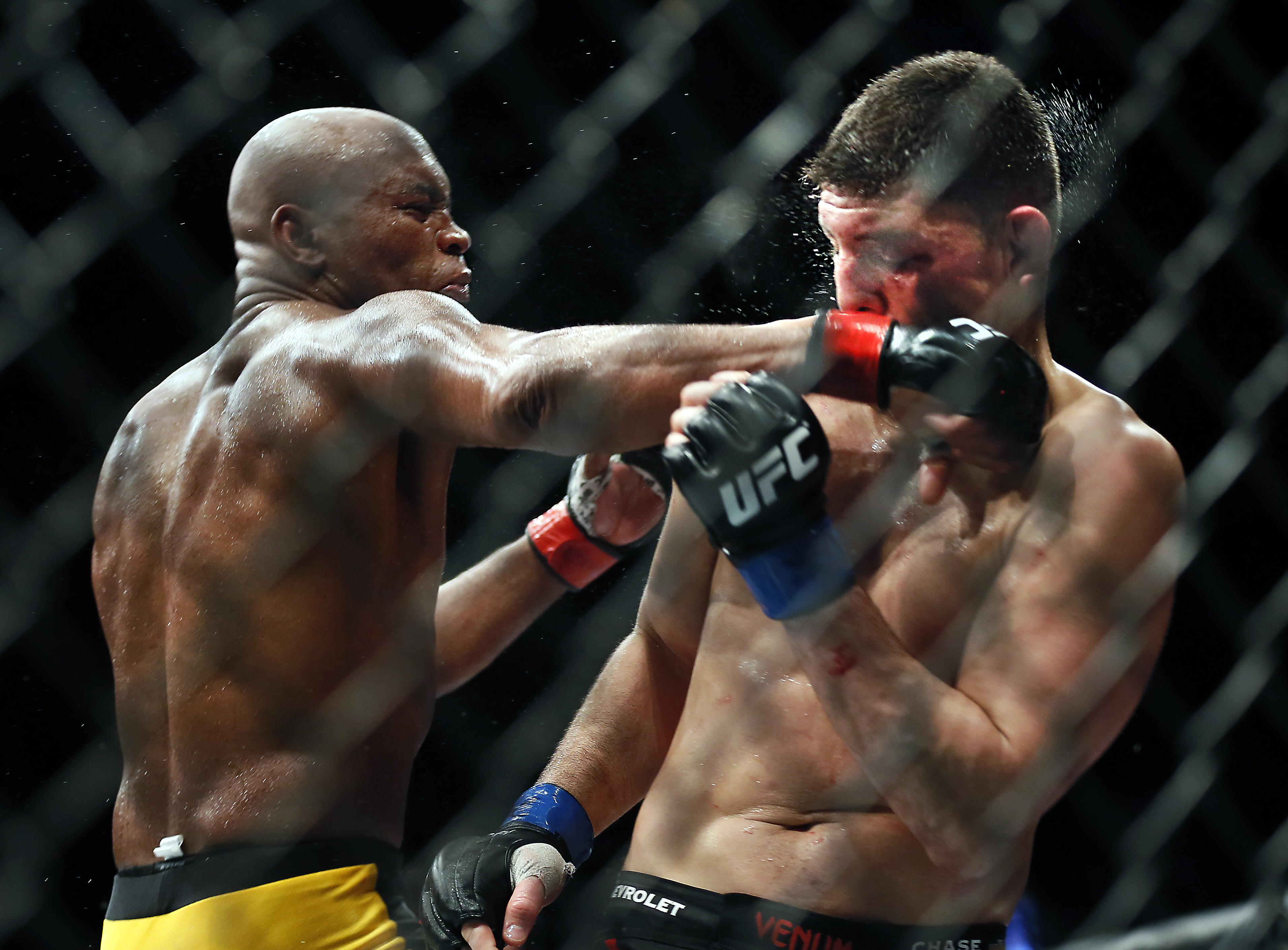 Middleweight Anderson Silva punches Nick Diaz during their fight at the MGM Grand Garden Arena in Las Vegas on Saturday, Jan. 31, 2015