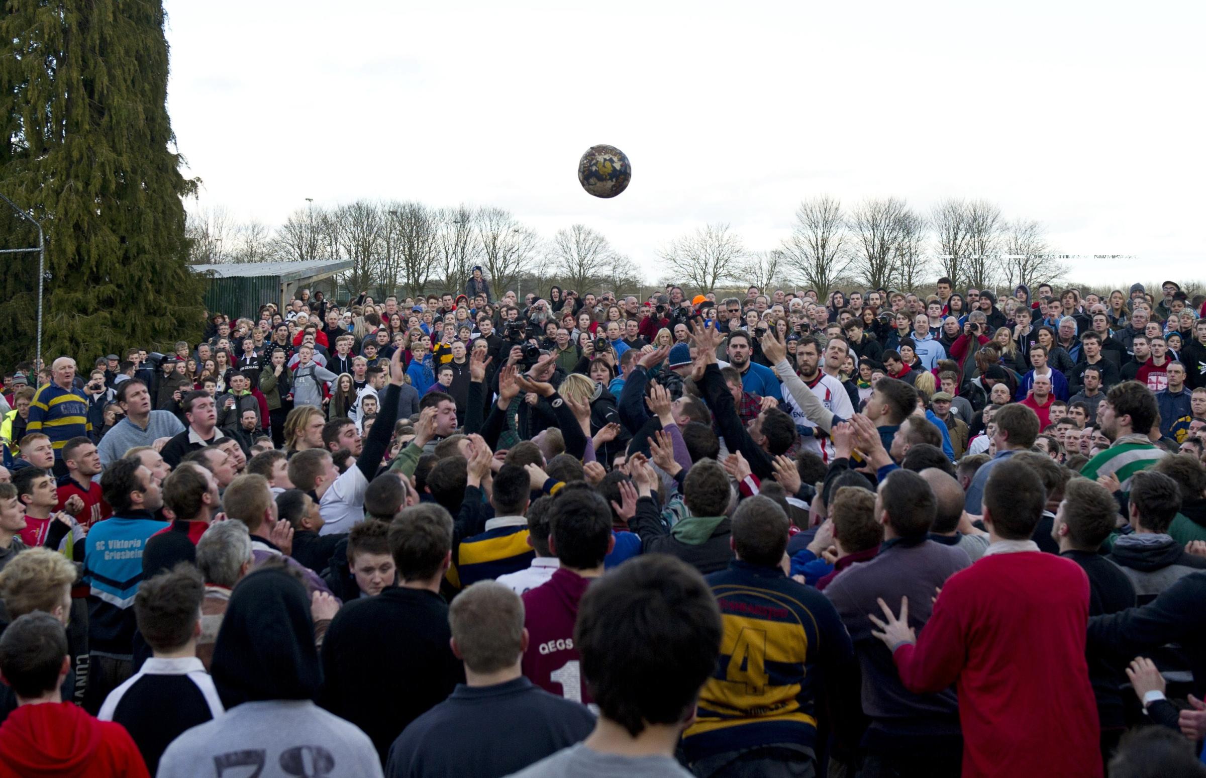 Opposing teams of the Up'ards and the Down'ards compete at the start of the annual Royal Shrovetide Football Match in Ashbourne, Derbyshire, England on February 17, 2015.