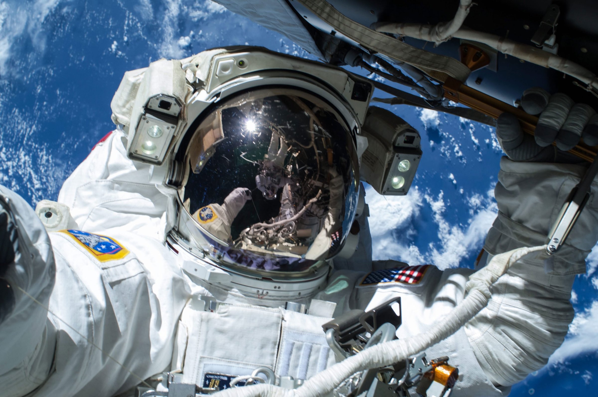 NASA astronaut Barry Wilmore operating outside the International Space Station (ISS) on the first of three spacewalks preparing the station for future arrivals by US commercial crew spacecraft, in space, 21 Feb. 21, 2015.