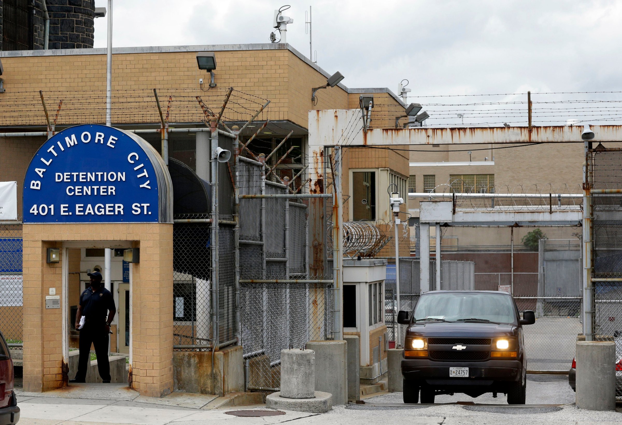 An inmate transport van departs from the Baltimore City Detention Center in Baltimore on June 6, 2013.