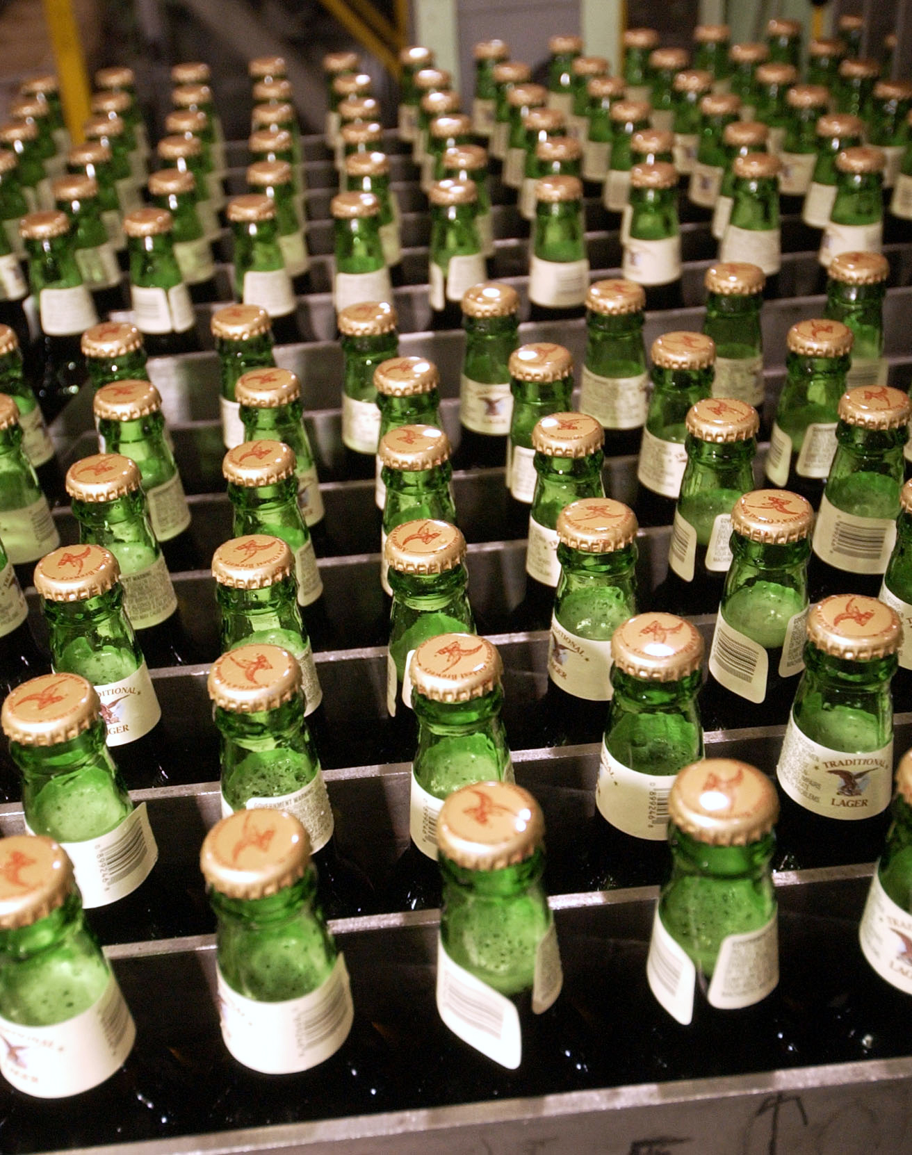 Full bottles of lager await to be loaded into cases at the Yuengling brewery in Pottsville, Pennsylvania on June 29, 2005. (Bloomberg—Bloomberg via Getty Images)