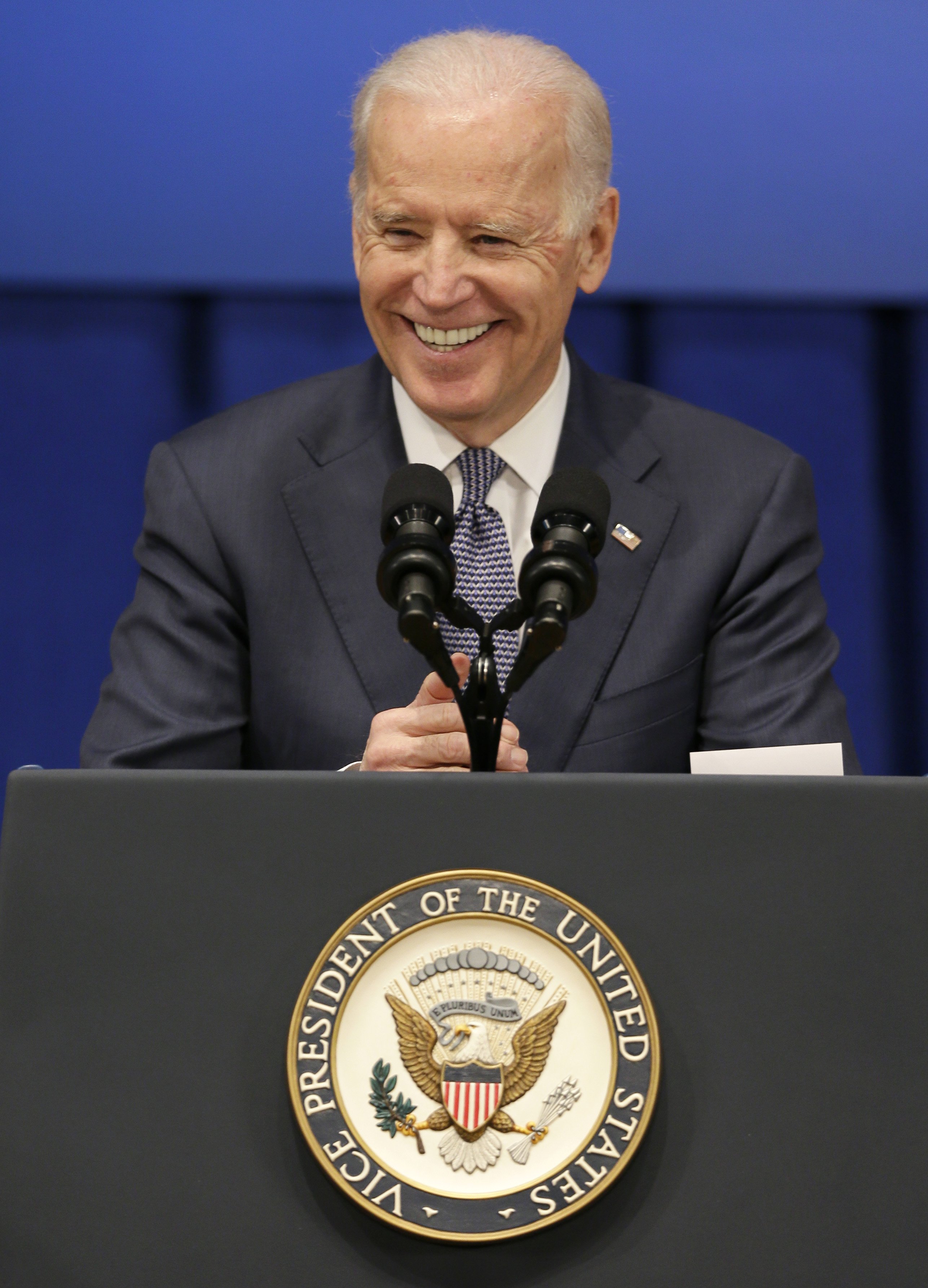 Vice President Joe Biden smiles as he speaks about the economy and the Obama administration's policies on Feb. 12, 2015, at Drake University in Des Moines, Iowa. (Charlie Neibergall—AP)