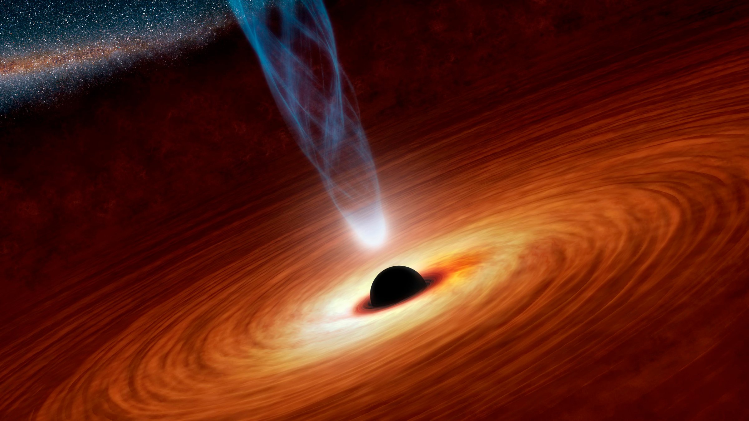 An artist's illustration shows a supermassive black hole with millions to billions times the mass of our sun at the center released by NASA on February 27, 2013.