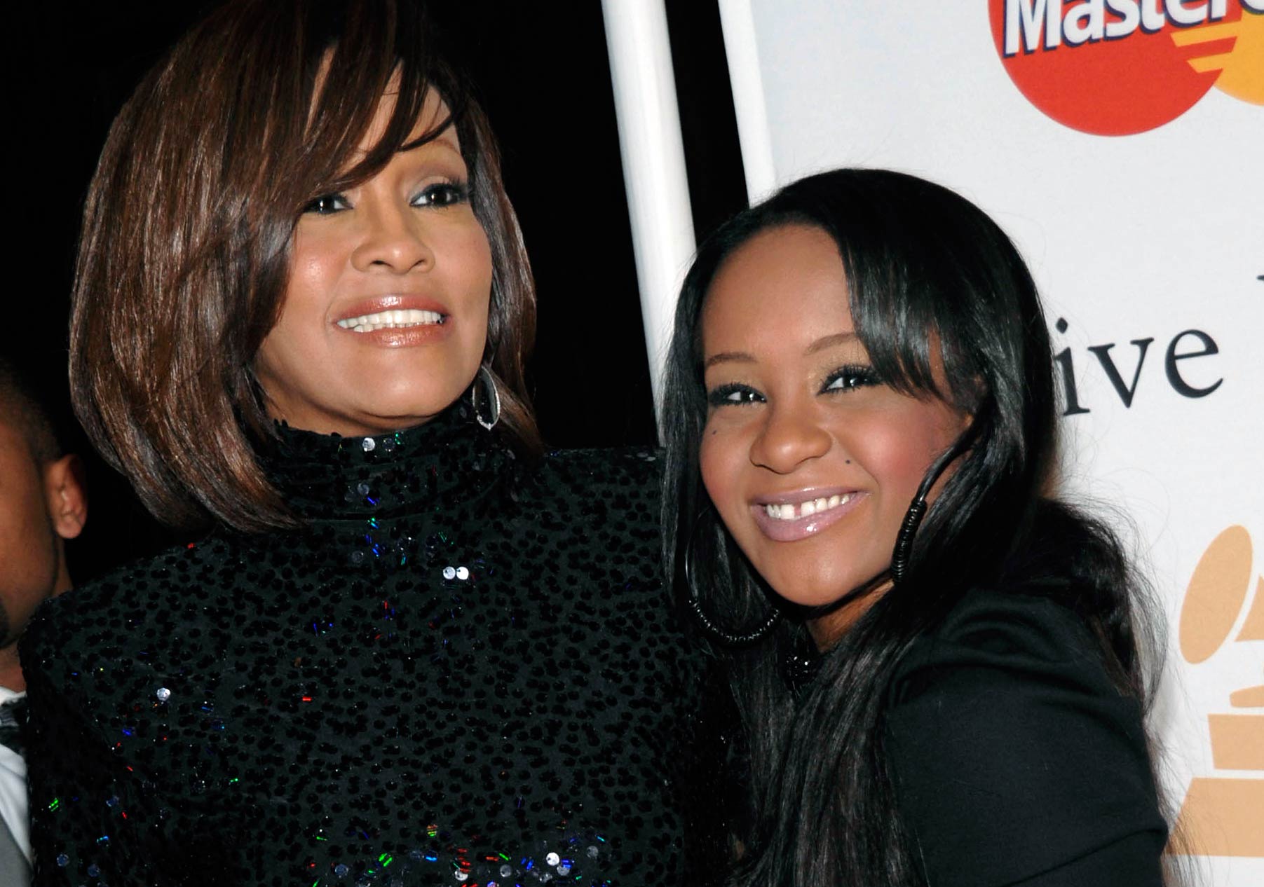 Whitney Houston, left, and her daughter Bobbi Kristina Brown arrive at an event in Beverly Hills, Calif. on Feb. 12, 2011. (Dan Steinberg—AP)