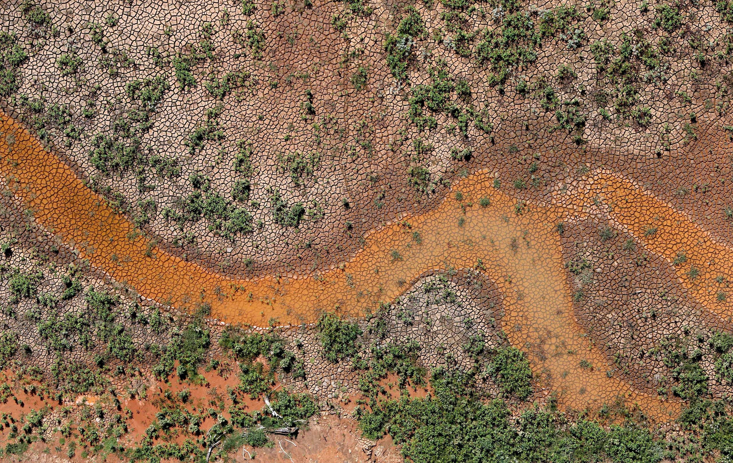 An aerial view of the cracked ground of the Atibainha dam, part of the Cantareira reservoir, is seen during a drought in Nazare Paulista, Sao Paulo state, Feb, 12, 2015.