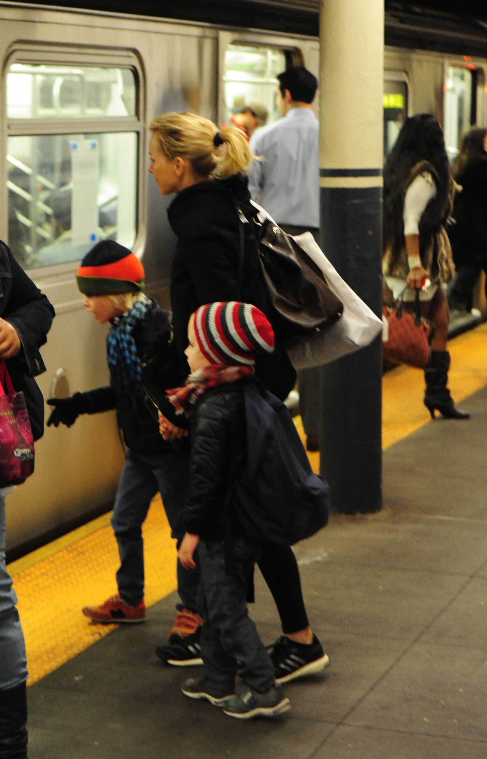 Naomi Watts takes the New York Subway with Alexander Schreiber and Samuel Schreiber on their way to school