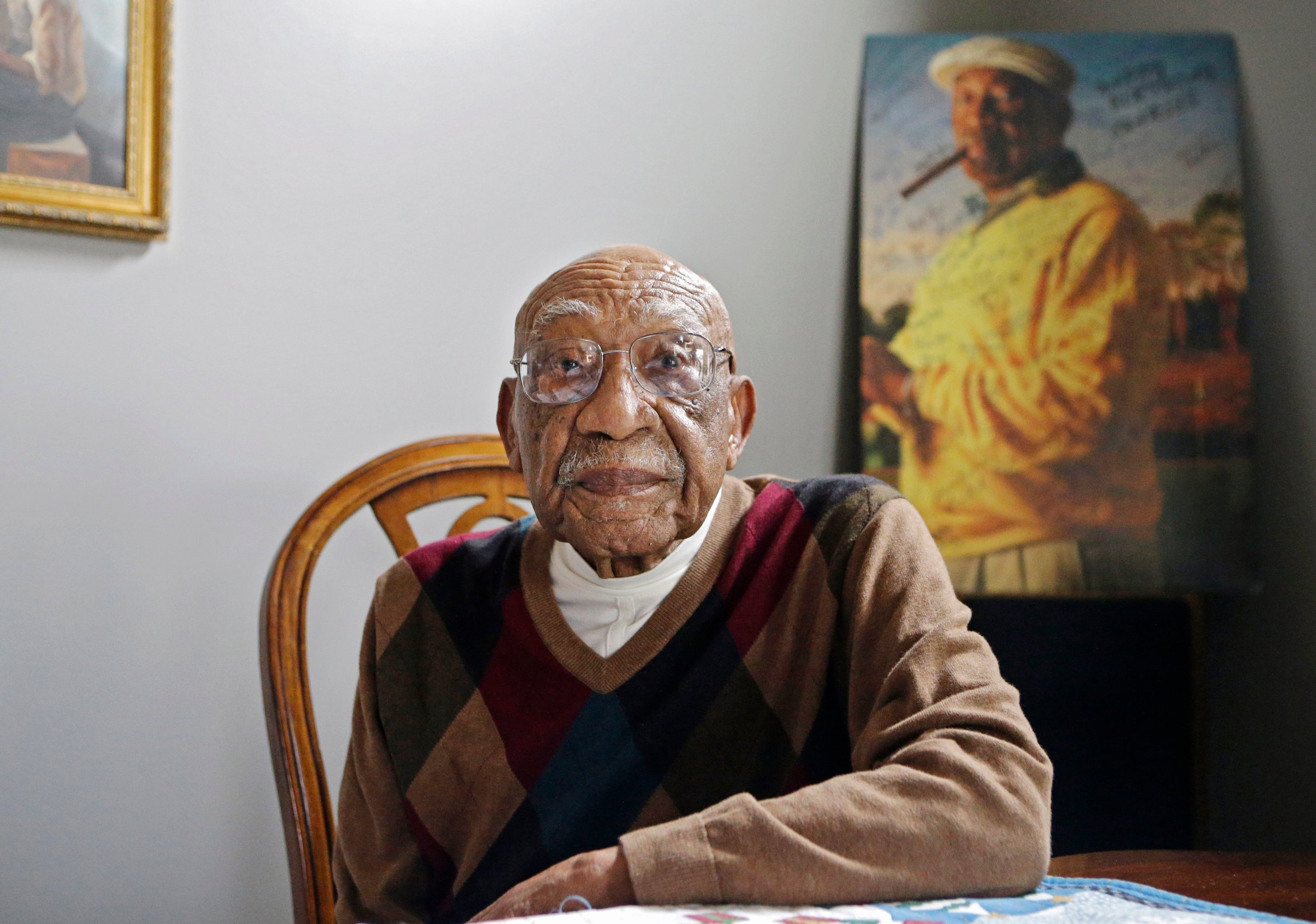 Former PGA golfer Charlie Sifford sits in the dining room of his home in Brecksville, Ohio on Nov. 13, 2014