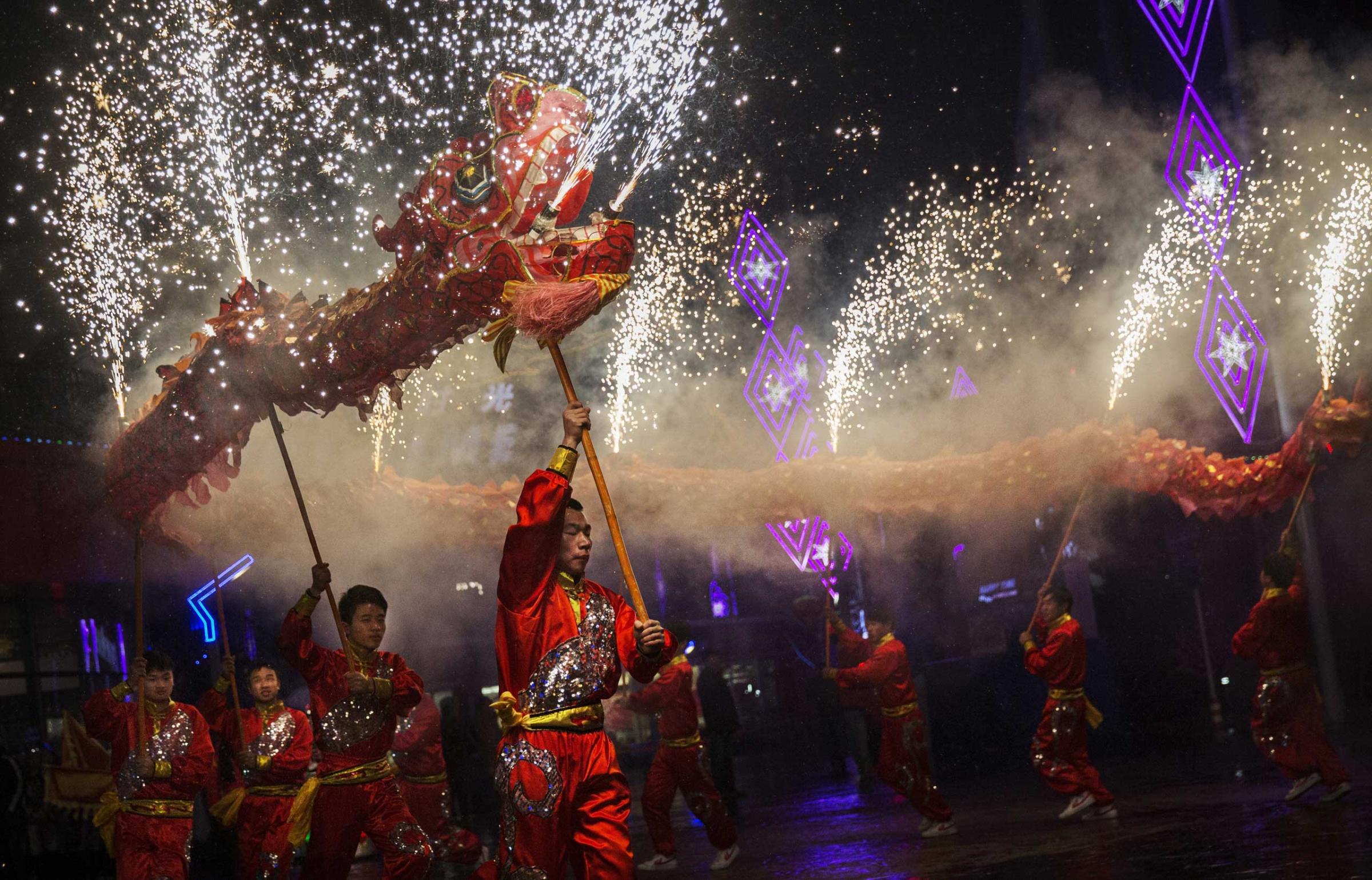 Chinese artists perform a dragon dance at a local amusement park during celebrations for the Lunar New Year, Feb. 19, 2015 in Beijing.