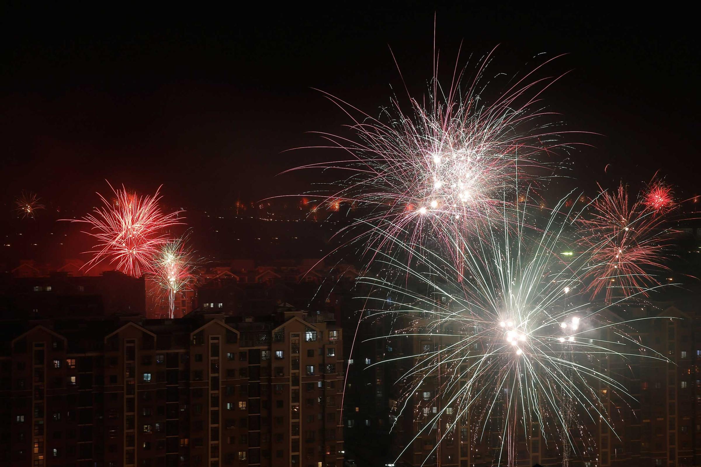 Fireworks illuminate the skyline to celebrate Chinese Lunar New Year of Sheep on Feb. 18, 2015 in Beijing.