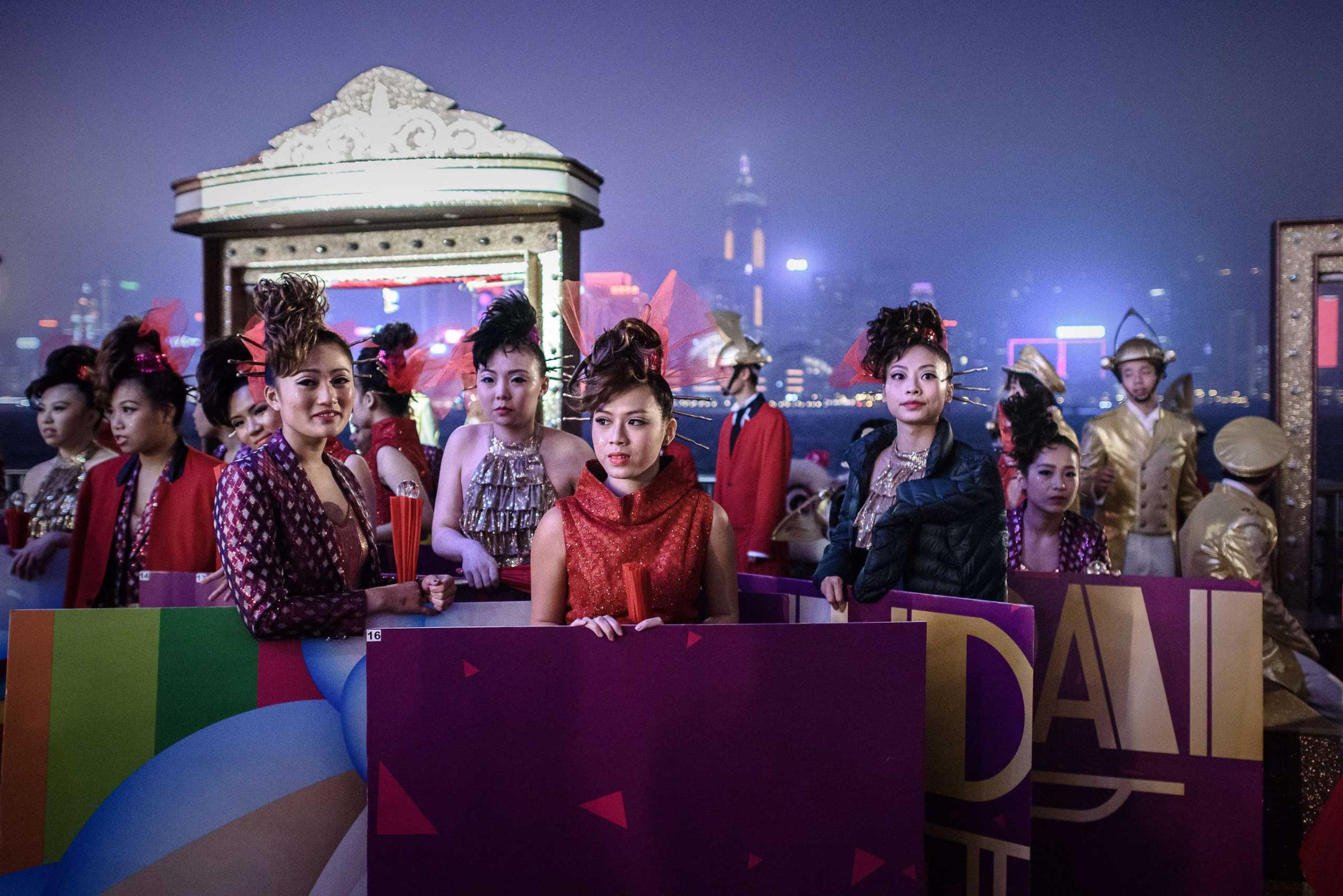 Performers wait for the start of the celebrations of the Chinese Lunar New "Year of the Sheep" in Hong Kong on Feb. 19, 2015.