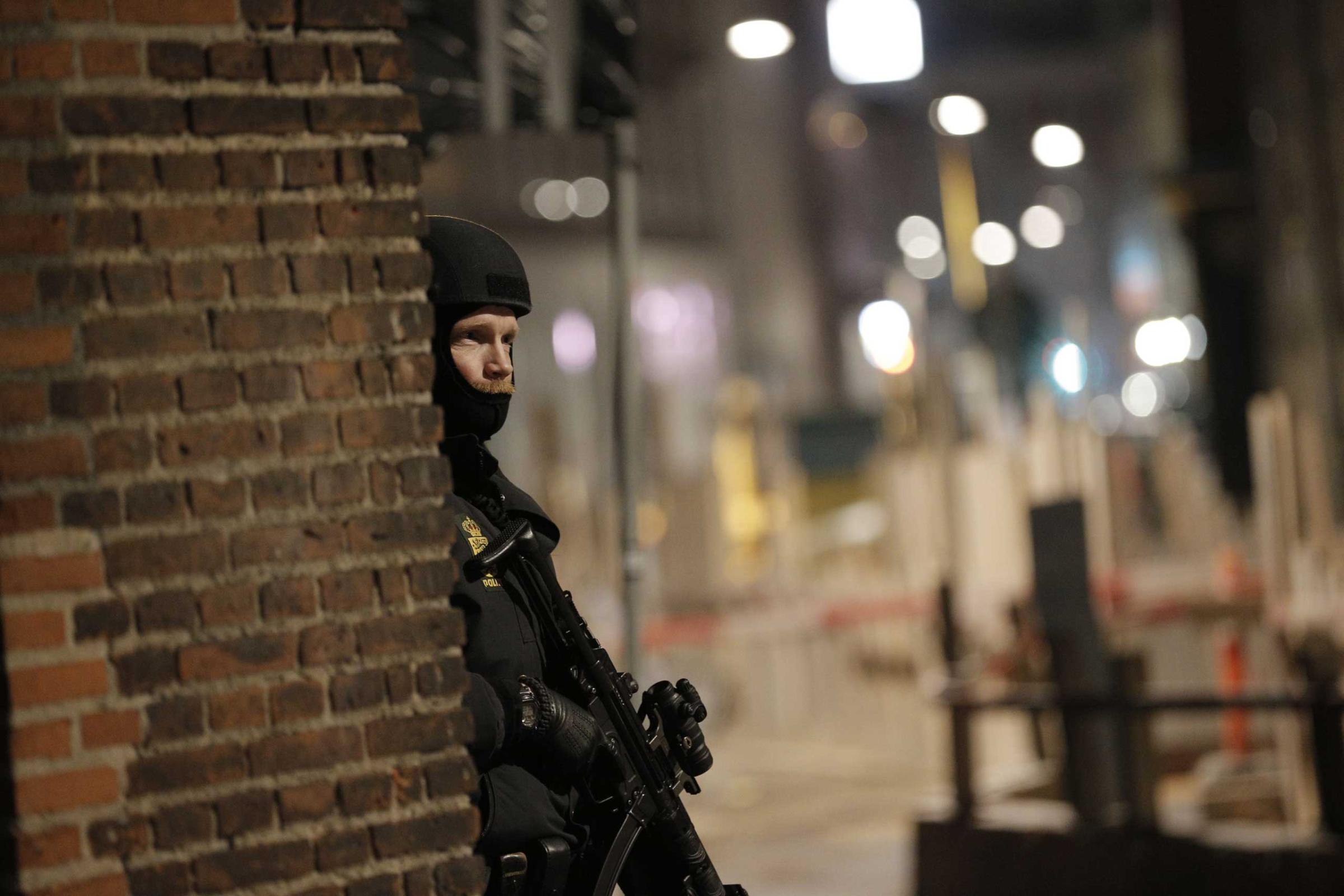 A police officer stands his post on the streets of central Copenhagen on Feb. 15, 2015.