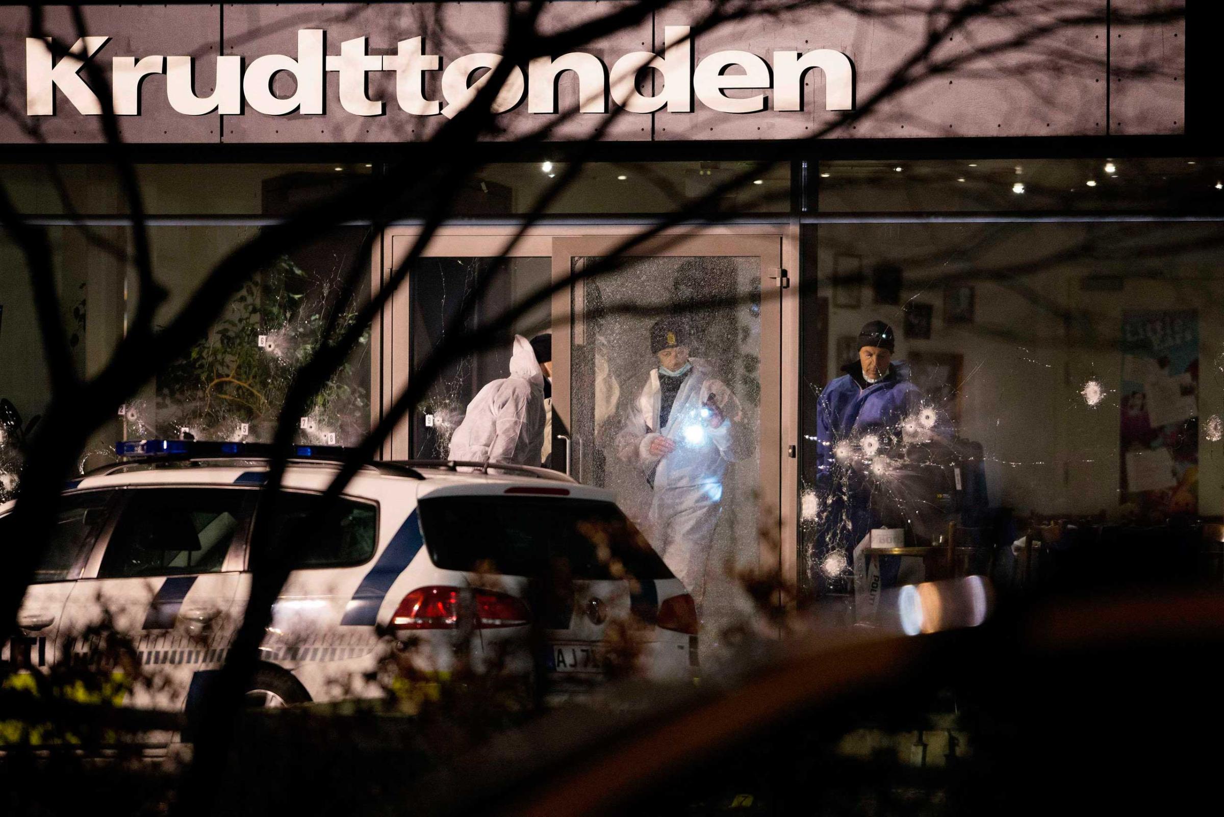 Forensic investigators are seen at the site of a shooting in Copenhagen, Feb. 14, 2015.