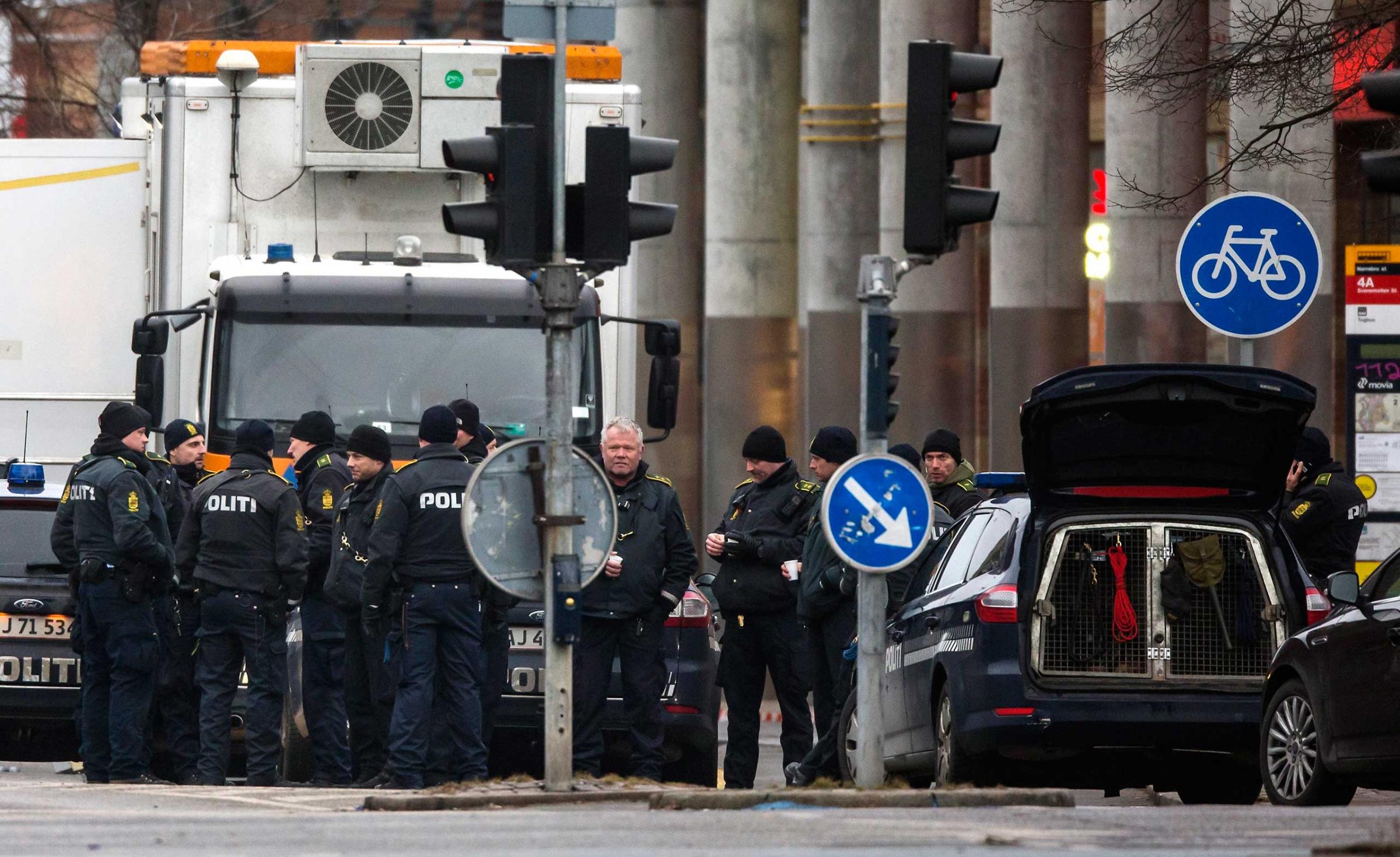 Police officers gather near the site where a man was killed by police, close to Norrebro Station, in Copenhagen, Feb. 15, 2015.