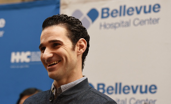 Dr. Craig Spencer smiles during a news conference November 11, 2014 at Bellevue Hospital in New York.