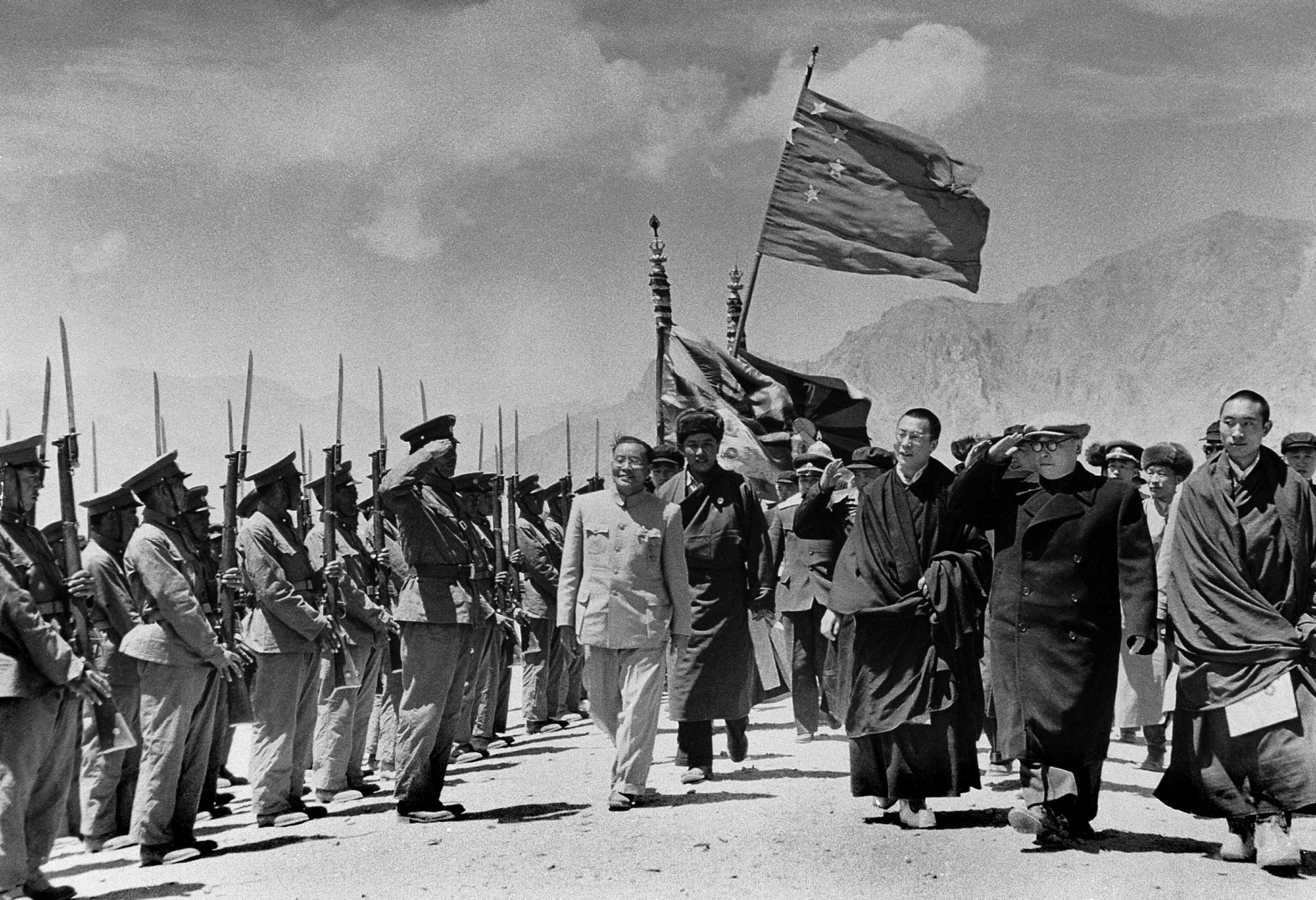 Dalai Lama seen with members of a Chinese government delegation on their official visit to Tibet in 1956.