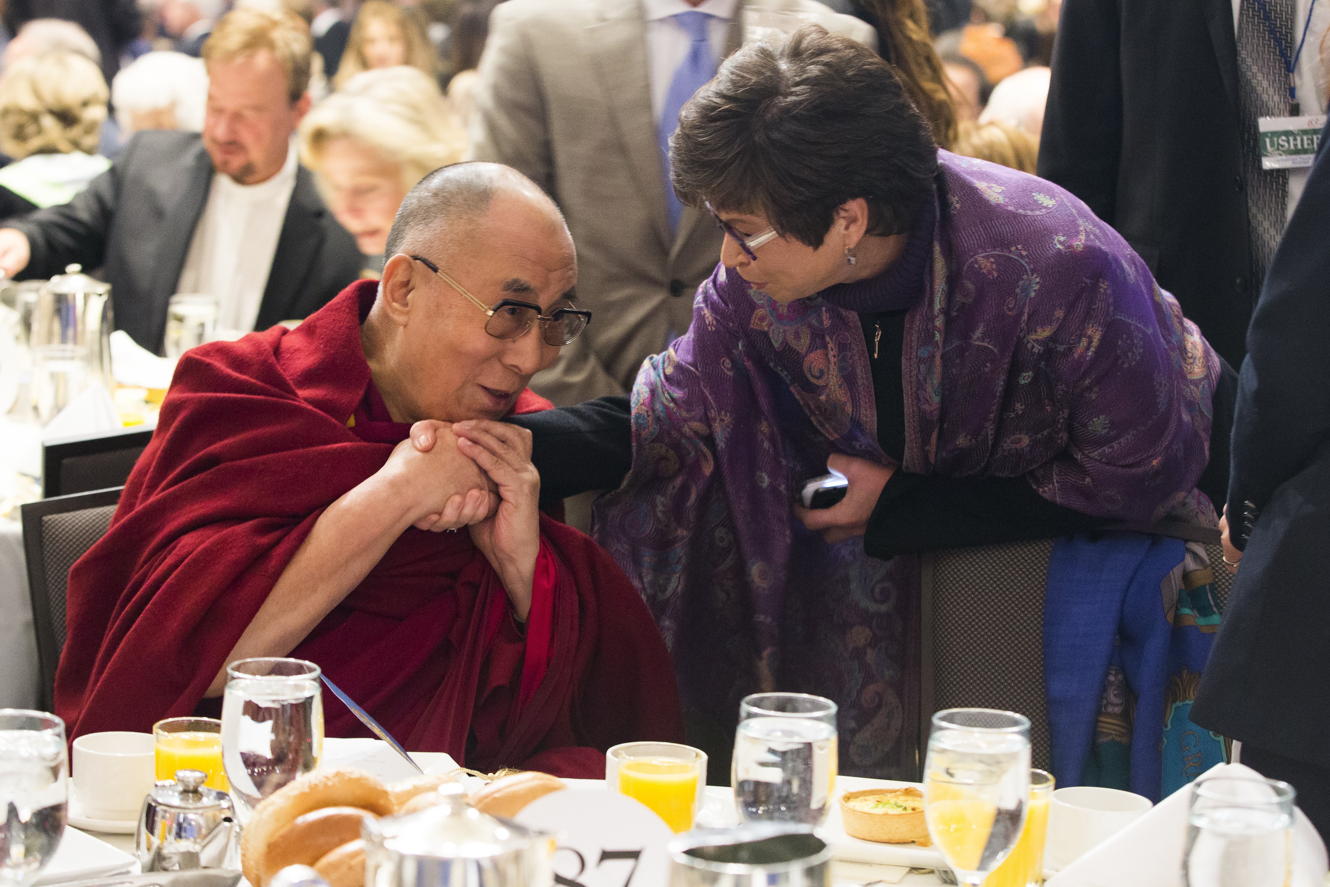 Valerie Jarrett, senior adviser to President Barack Obama, talks with the Dalai Lama during the National Prayer Breakfast in Washington D.C., on Feb. 5, 2015 (Evan Vucci—AP)