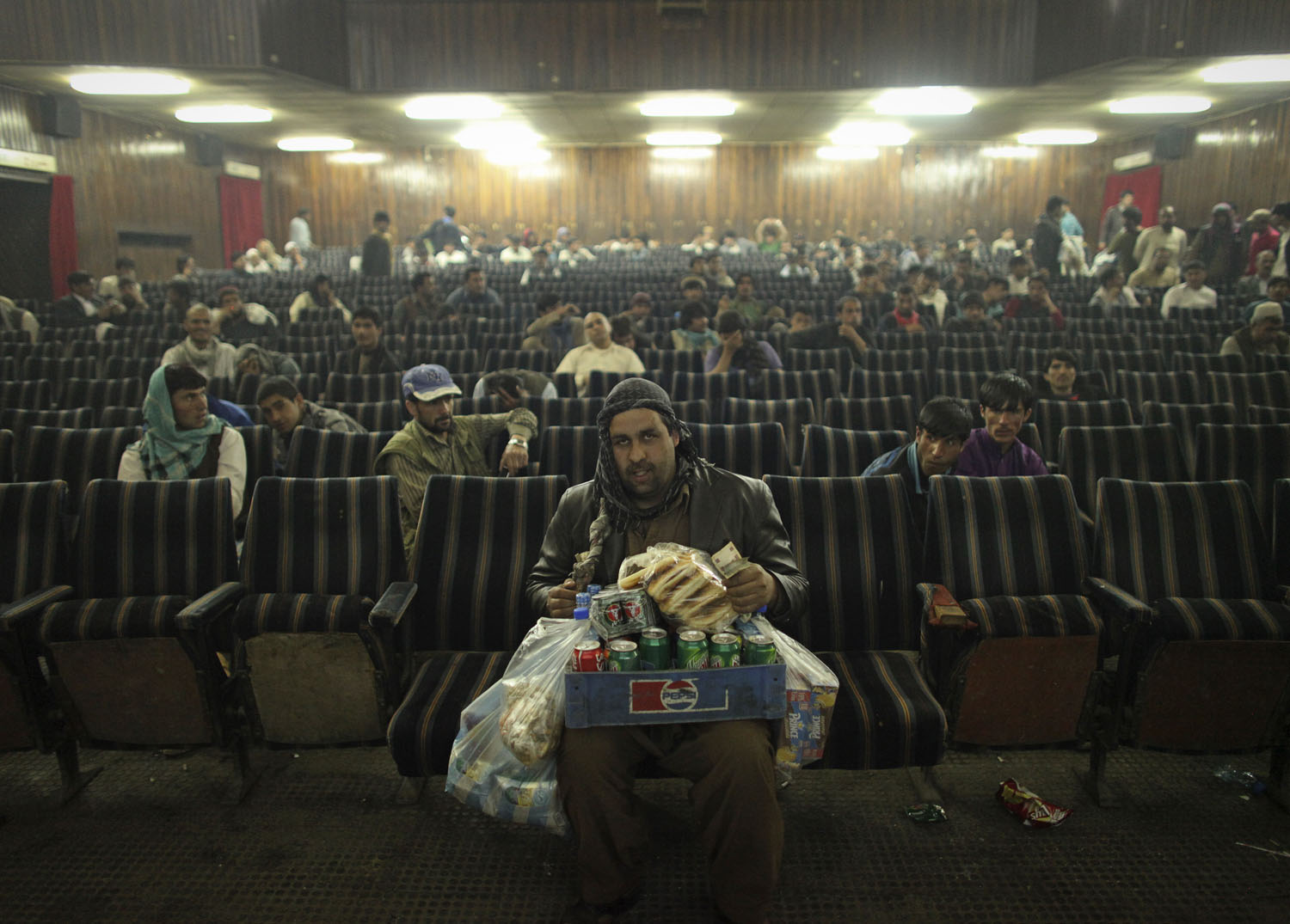 An employee of Cinema Pamir sells refreshments during the movie interval in Kabul
