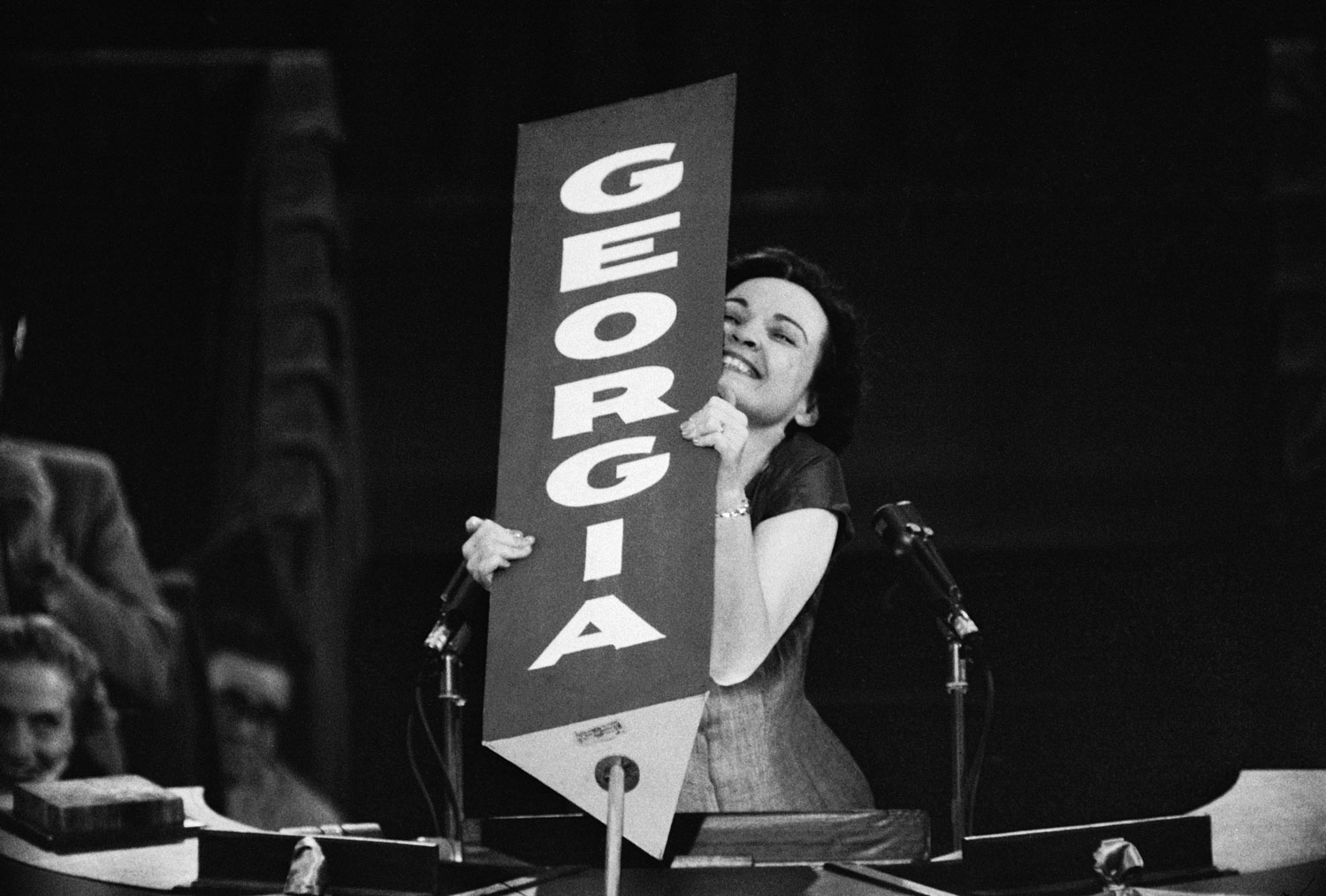 Georgia Congresswoman Iris Blitch, a staunch segregationist during her time in Congress, being saluted by her state's delegates before her speech at the 1956 Democratic National Convention in Chicago.