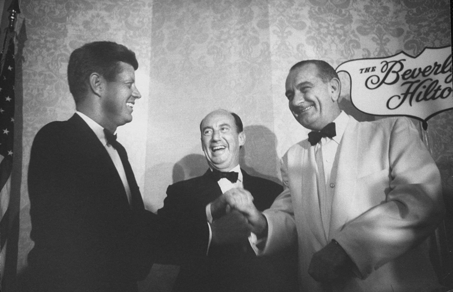 Adlai Stevenson (center) and Lyndon Johnson (right) congratulate John F. Kennedy on winning the party's presidential nomination at the 1960 Democratic National Convention in Los Angeles.