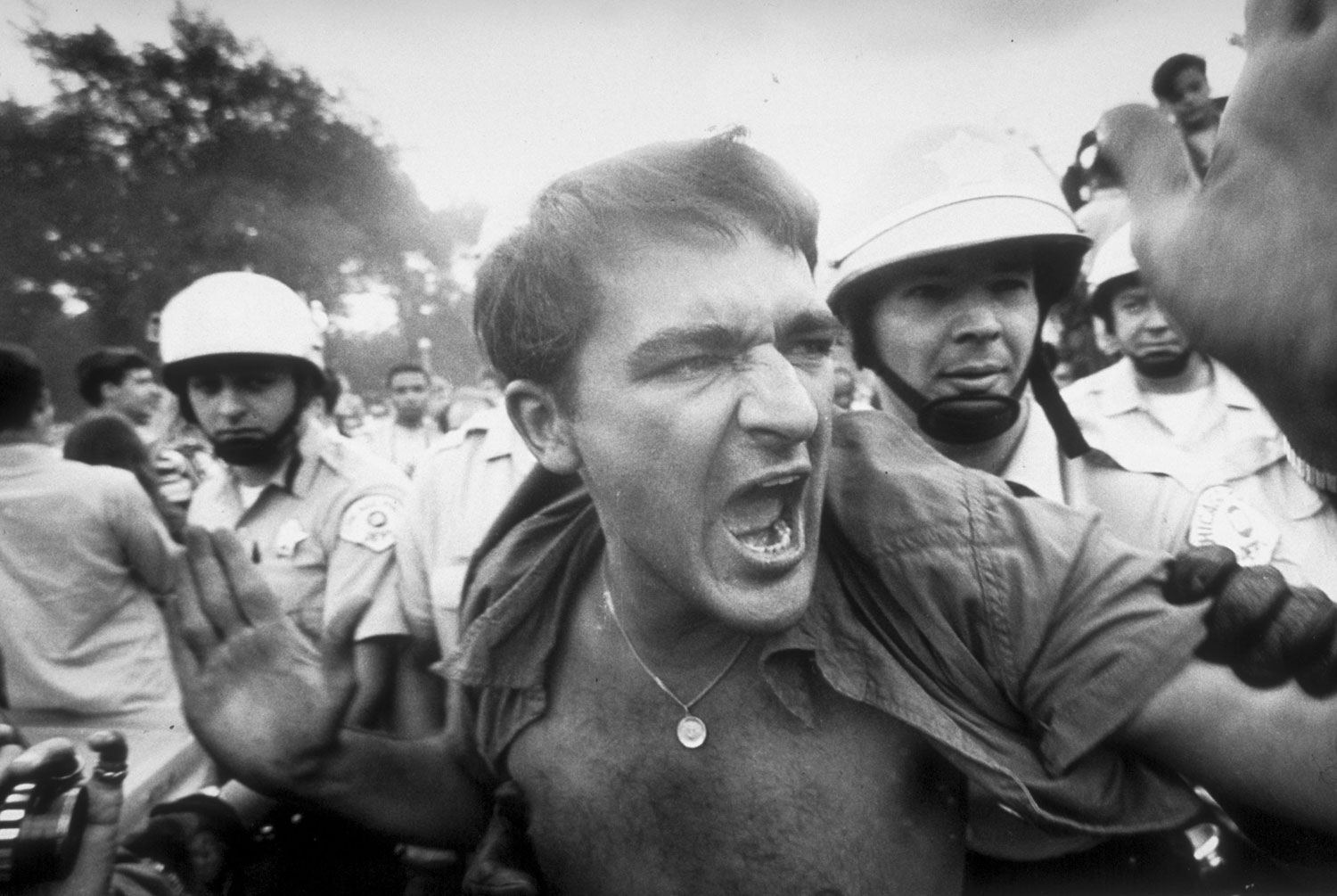 A protestor is grabbed by police during a demonstration outside the Democratic National Convention in Chicago, 1968.