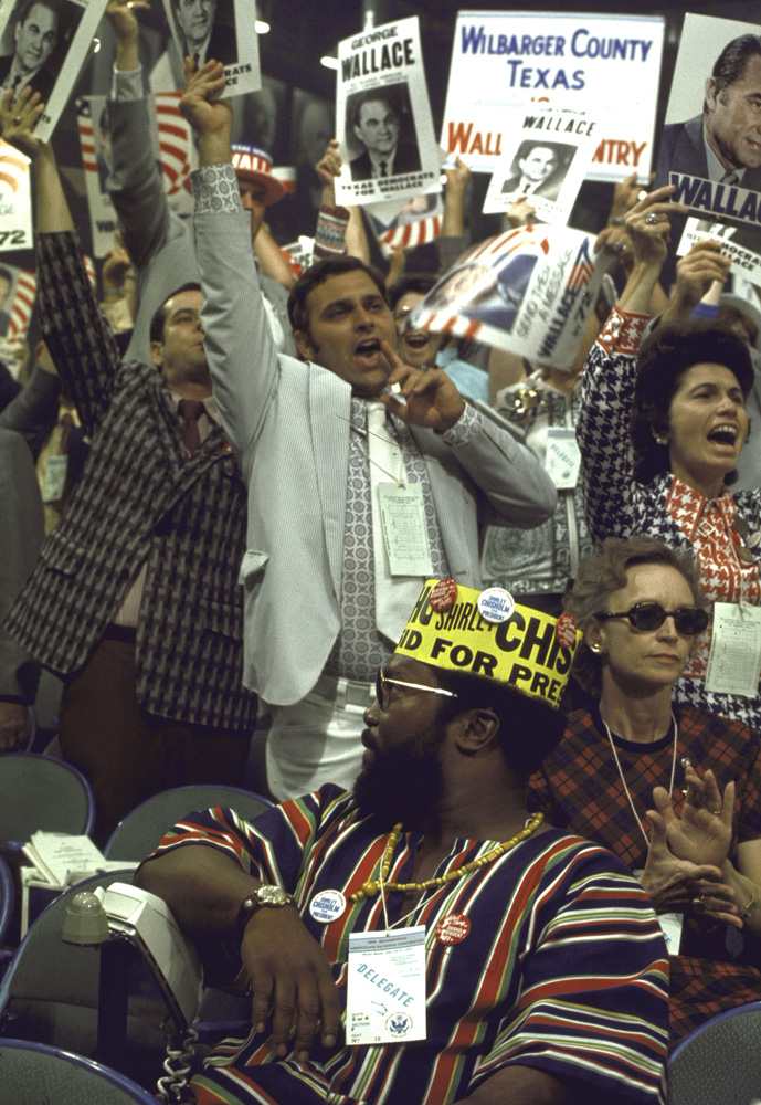 Delegates for Alabama's George Wallace cheer behind a delegate for New York's Shirley Chisholm—the first African-American woman ever elected to Congress—during the 1972 Democratic National Convention in Miami Beach.