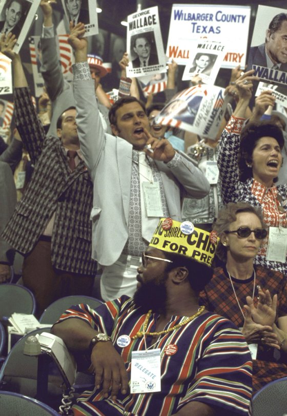 Delegates for Alabama's George Wallace cheer behind a delegate for New York's Shirley Chisholm—the first African-American woman ever elected to Congress—during the 1972 Democratic National Convention in Miami Beach.