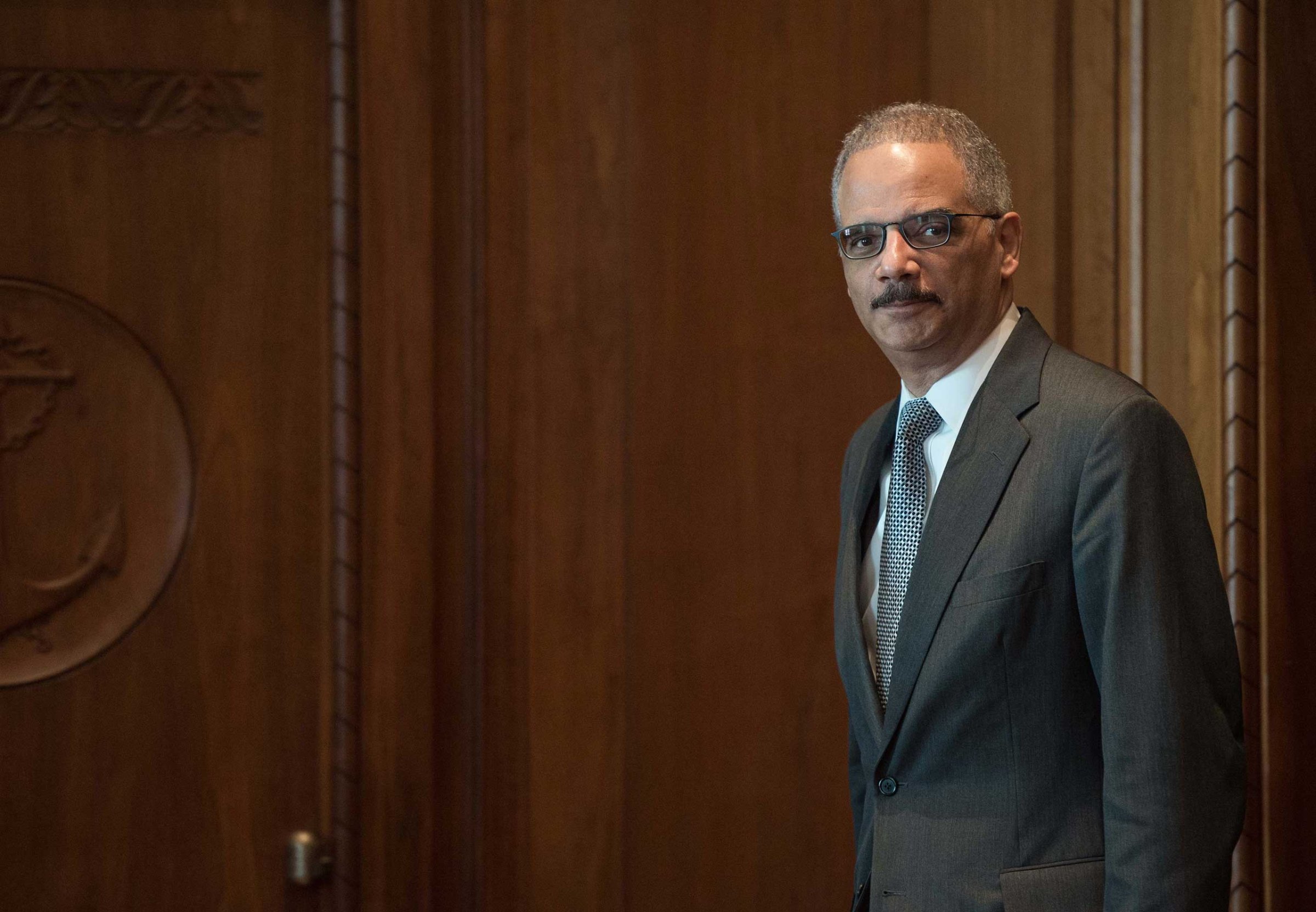 US Attorney General Eric Holder arrives for a meeting with French Interior Minister Bernard Cazeneuve at the Justice Department in Washington on Feb. 19, 2015.