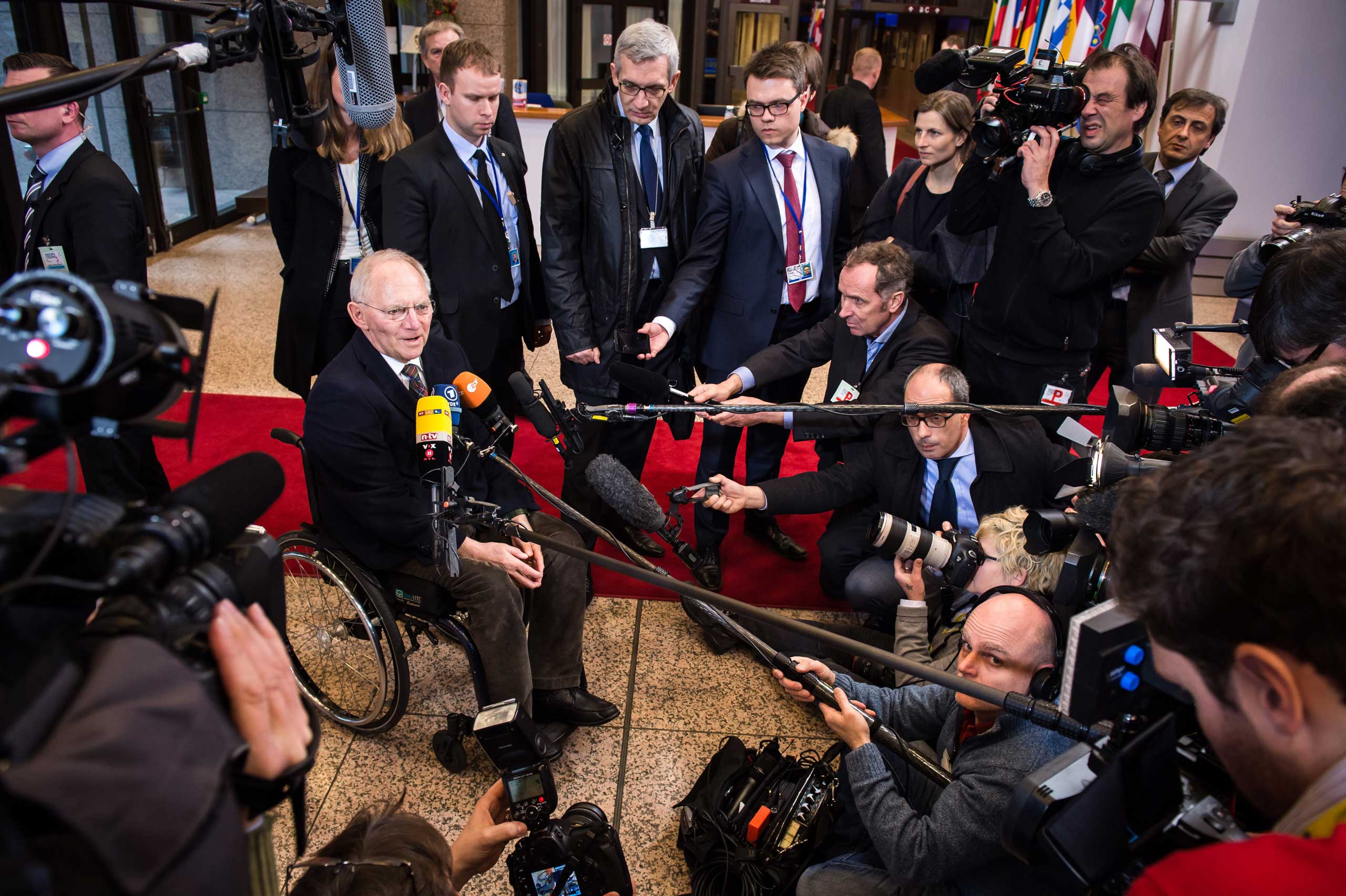 German Finance Minister Wolfgang Schaeuble, left, talks with journalists as he arrives for a meeting of Eurogroup finance ministers at the EU Council building in Brussels on Monday, Feb. 16, 2015. (Geert Vanden Wijngaert&mdash;AP)