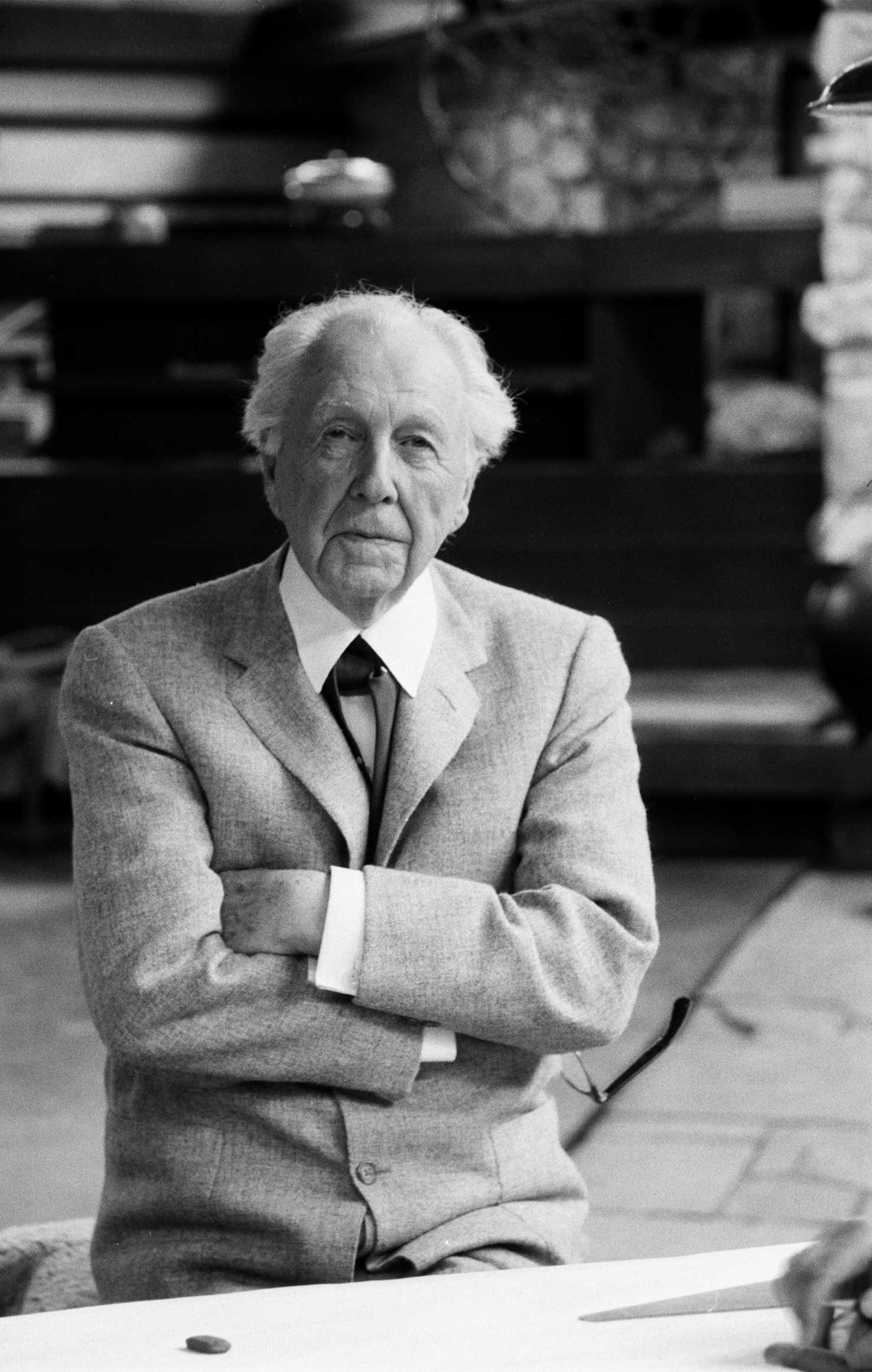 Frank Lloyd Wright 89, works 12-hour day running fellowship for aspiring architects, dances and swims, says: "The more I abused my physical resources, the more I had."