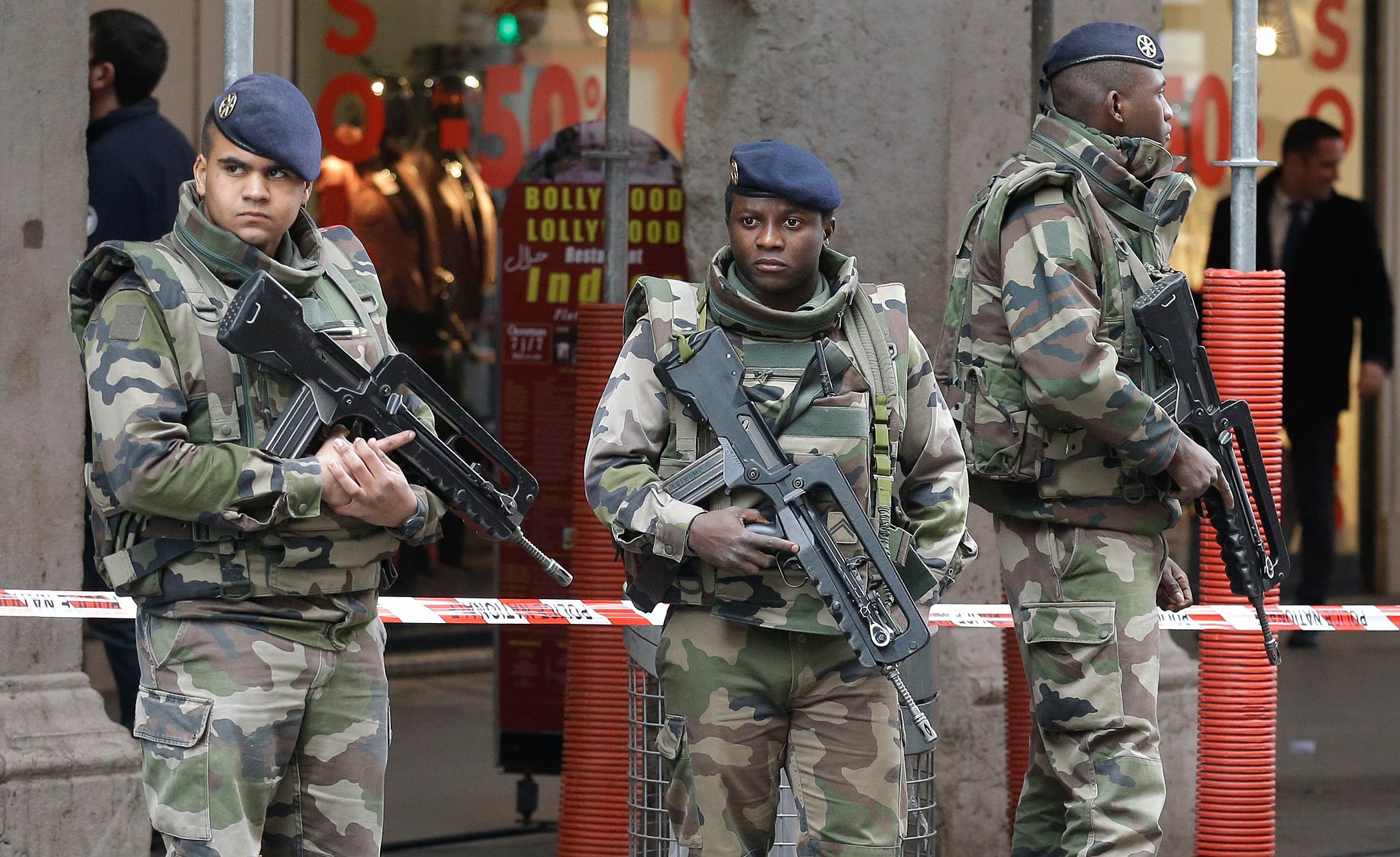 Soldiers stand guard after an attacker with a knife hidden in his bag attacked three soldiers on an antiterrorism patrol in front of a Jewish community center in Nice, France, on Feb. 3, 2015 (Lionel Cironneau—AP)
