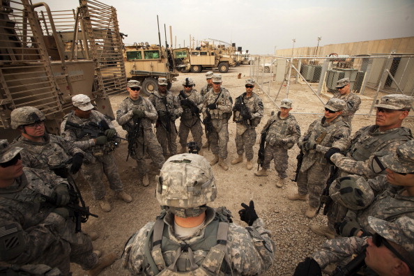 U.S. troops getting a last-minute briefing before leaving Iraq in 2011. (Lucas Jackson / Pool / Getty Images)
