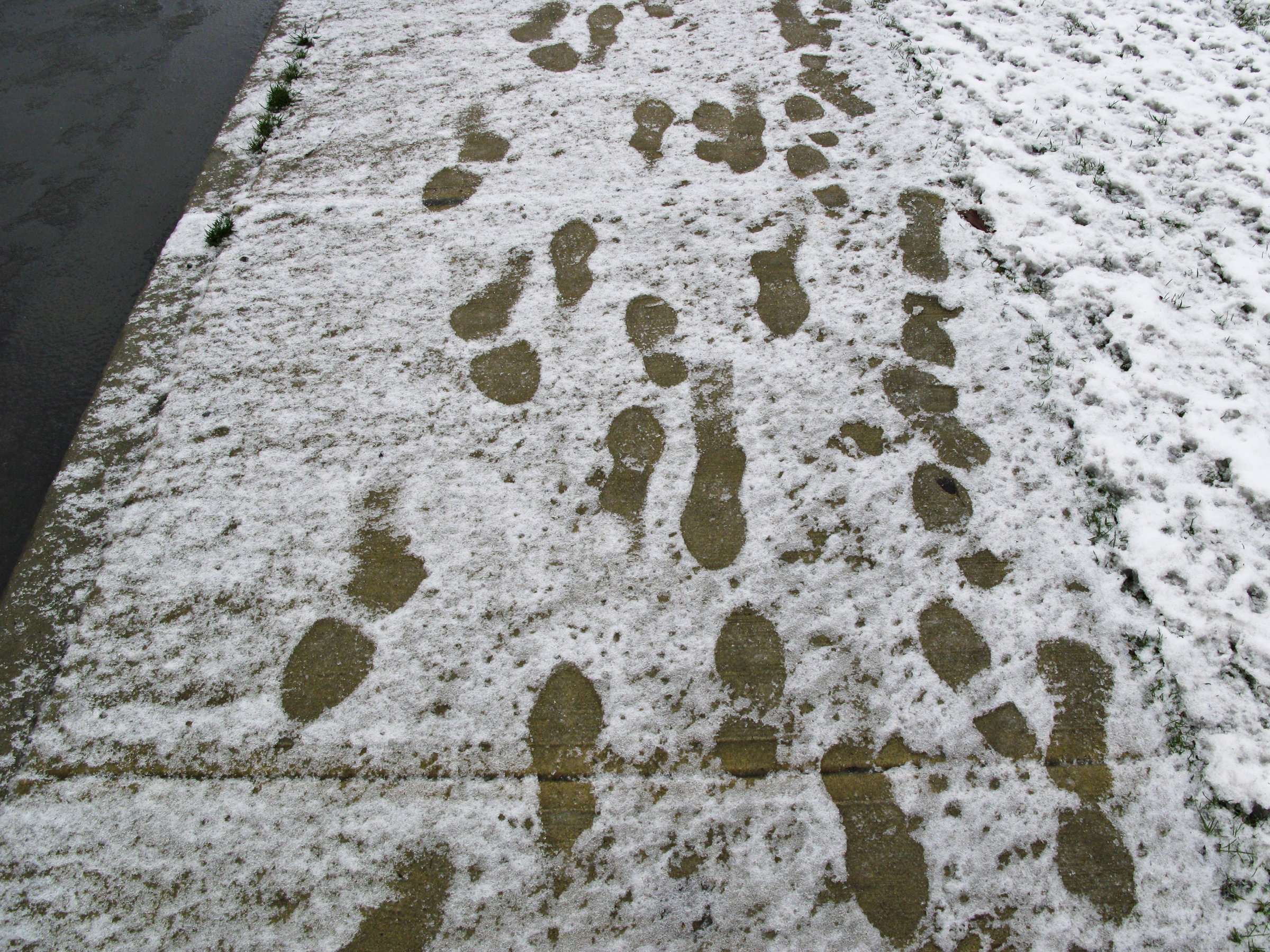 snowy-side-walk-footprints