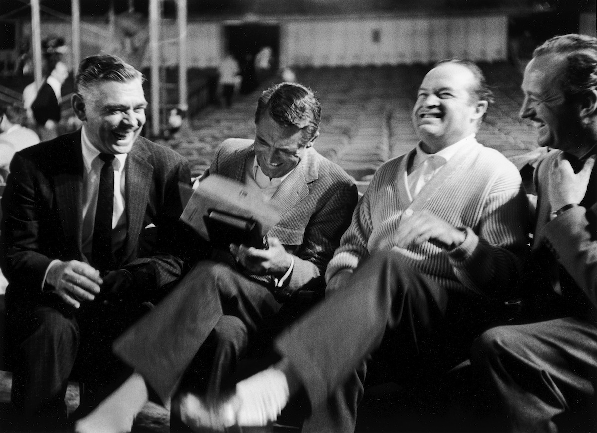 Clark Gable, Cary Grant, Bob Hope and David Niven laughing heartily together at one of Hope's recently-acquired Russian jokes during break from rehearsals for the 1958 Academy Awards (Leonard McCombe—The LIFE Picture Collection/Getty)