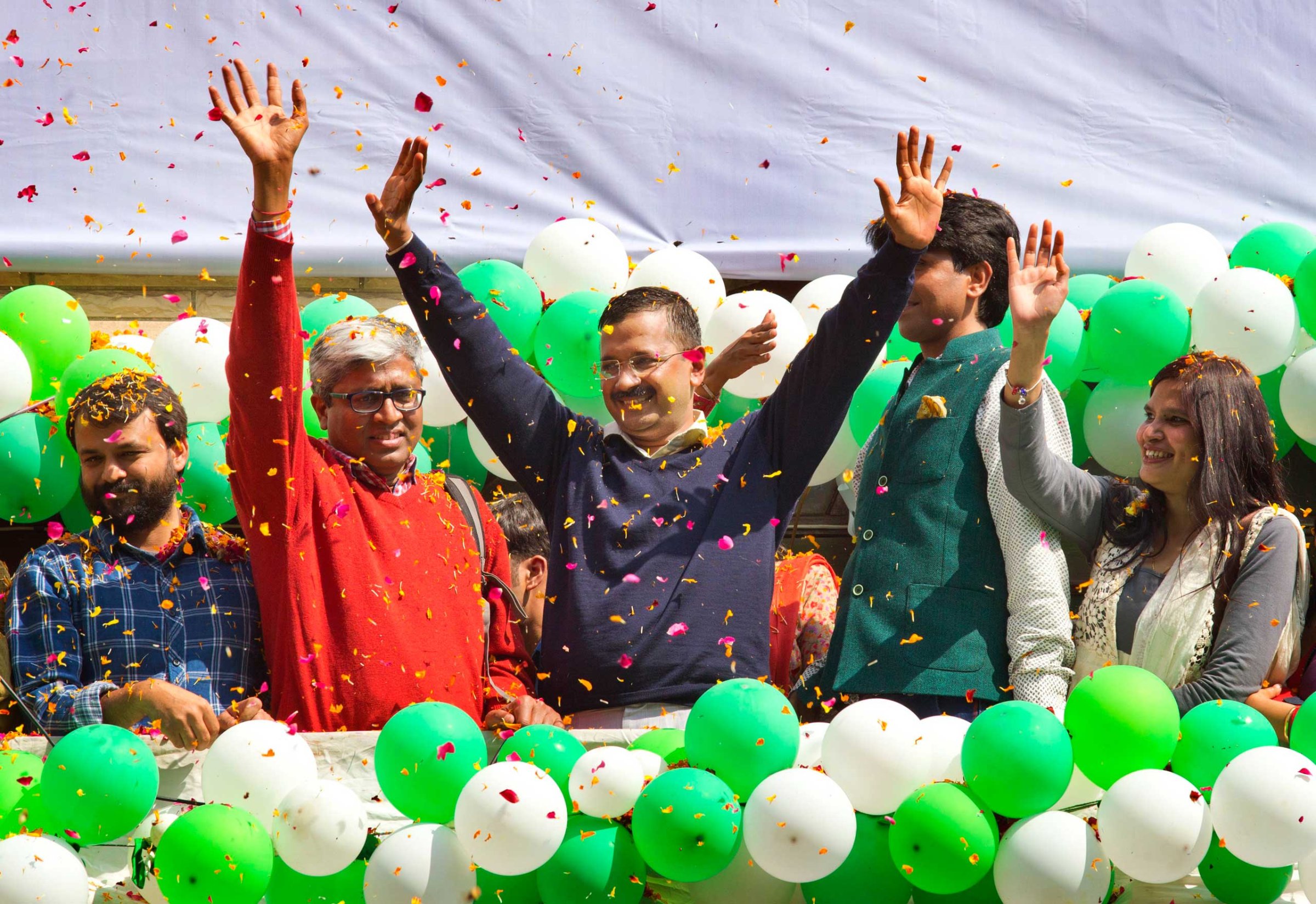 Indian Aam Aadmi Party leader Arvind Kejriwal speaks to supporters as he celebrates victory in the state assembly elections outside the party's headquarters in New Delhi on Feb. 10, 2015.