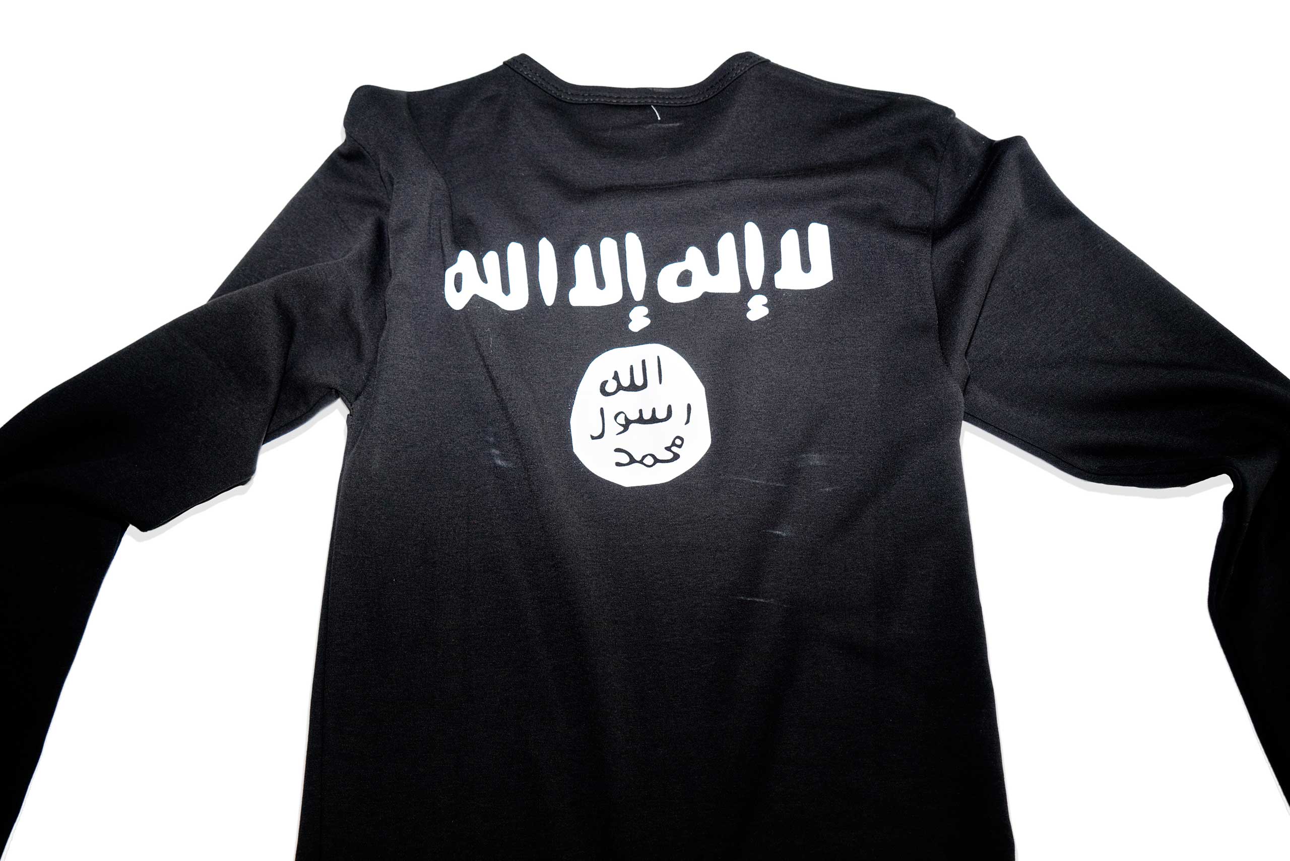 A long sleeve T-shirt with the iconography of Islamic State, found in a Islamic clothing and accessory shop in the Bagcilar district of Istanbul, Turkey.